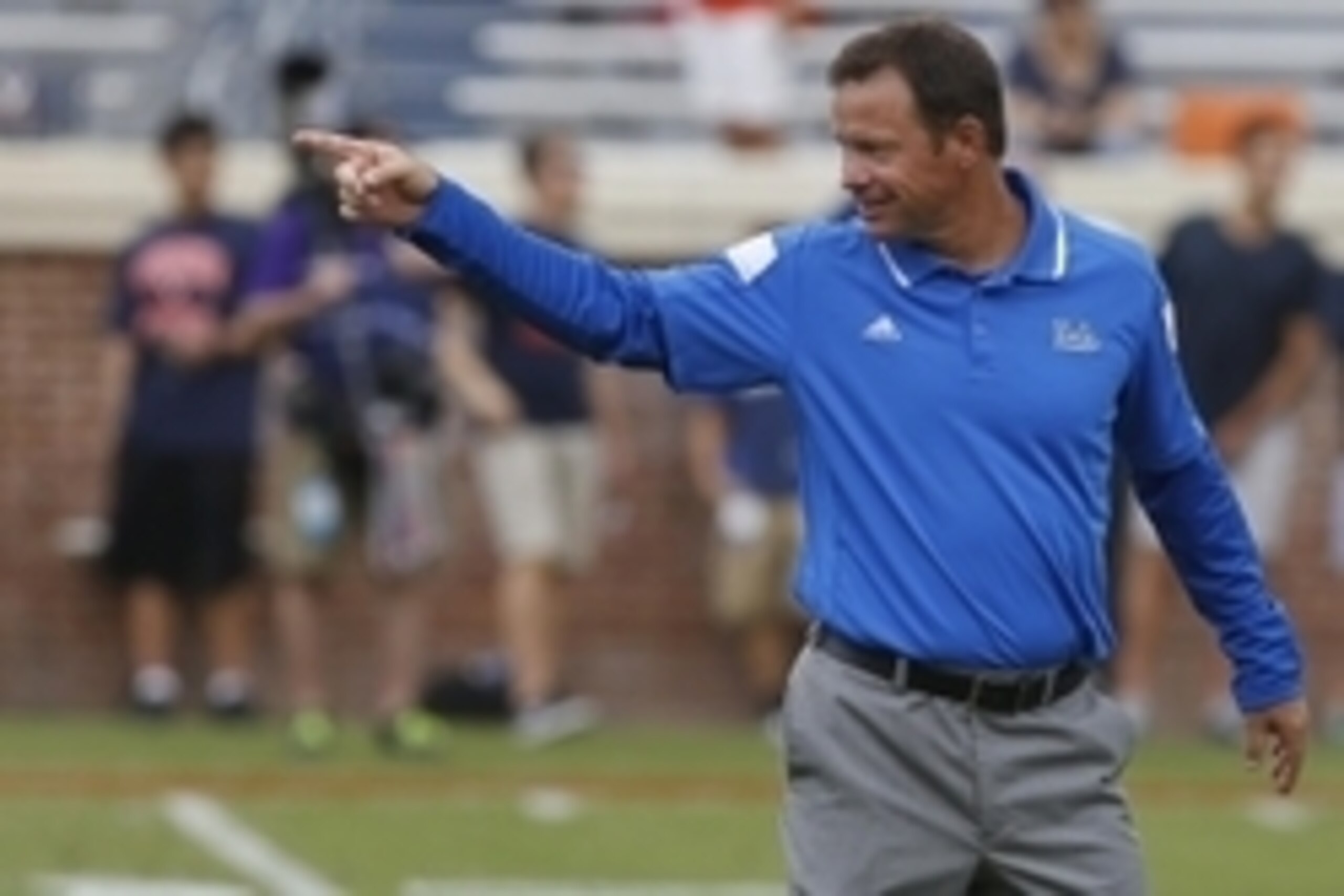 Aug 30, 2014; Charlottesville, VA, USA; UCLA Bruins head coach Jim Mora gestures on the field prior to the Bruins' game against the Virginia Cavaliers at Scott Stadium. The Bruins won 28-20. Mandatory Credit: Geoff Burke-USA TODAY Sports
