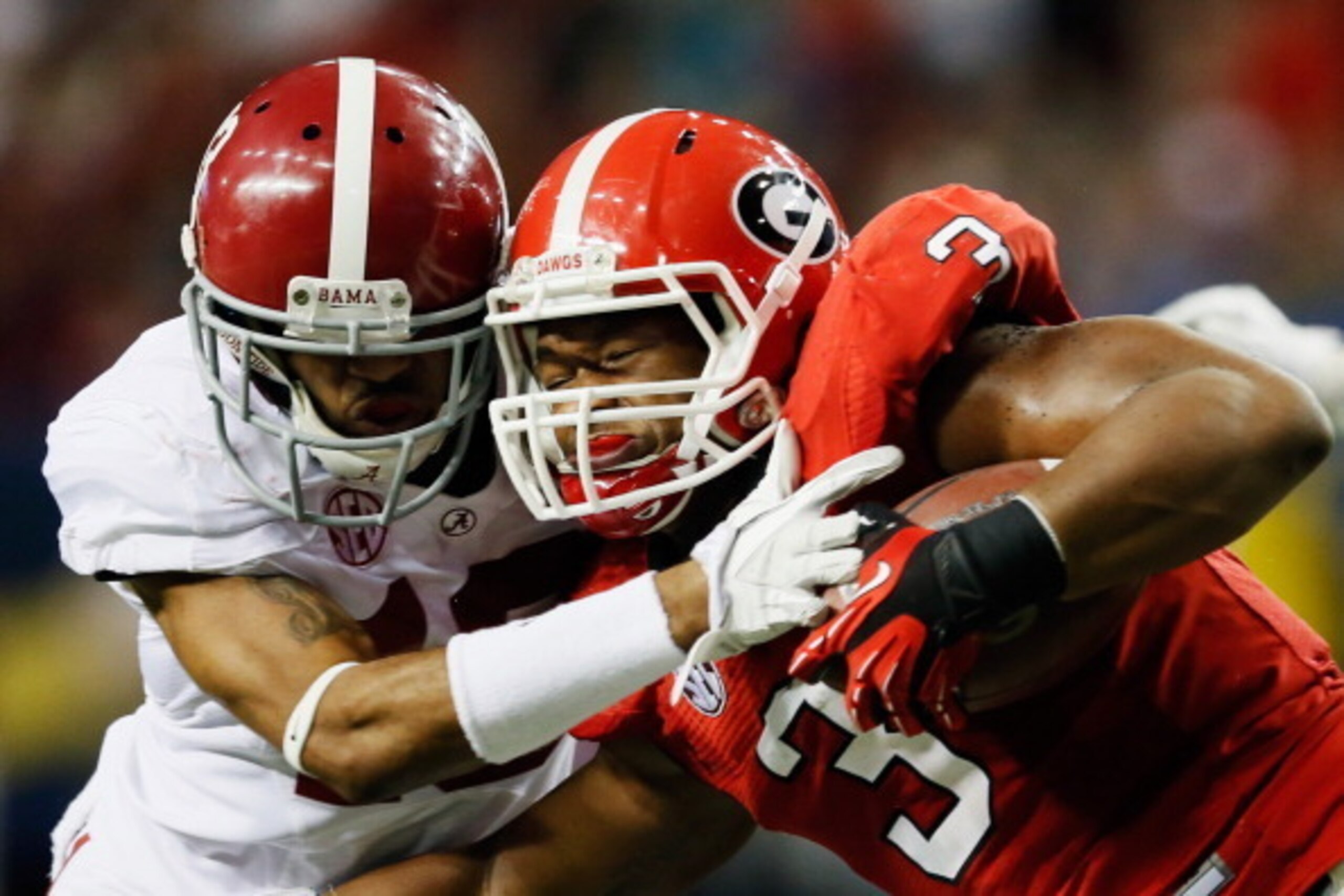 ATLANTA, GA - DECEMBER 01: Defensive back Deion Belue #13 of the Alabama Crimson Tide tackles running back Todd Gurley #3 of the Georgia Bulldogs during the first half of the SEC Championship Game at the Georgia Dome on December 1, 2012 in Atlanta, Georgi
