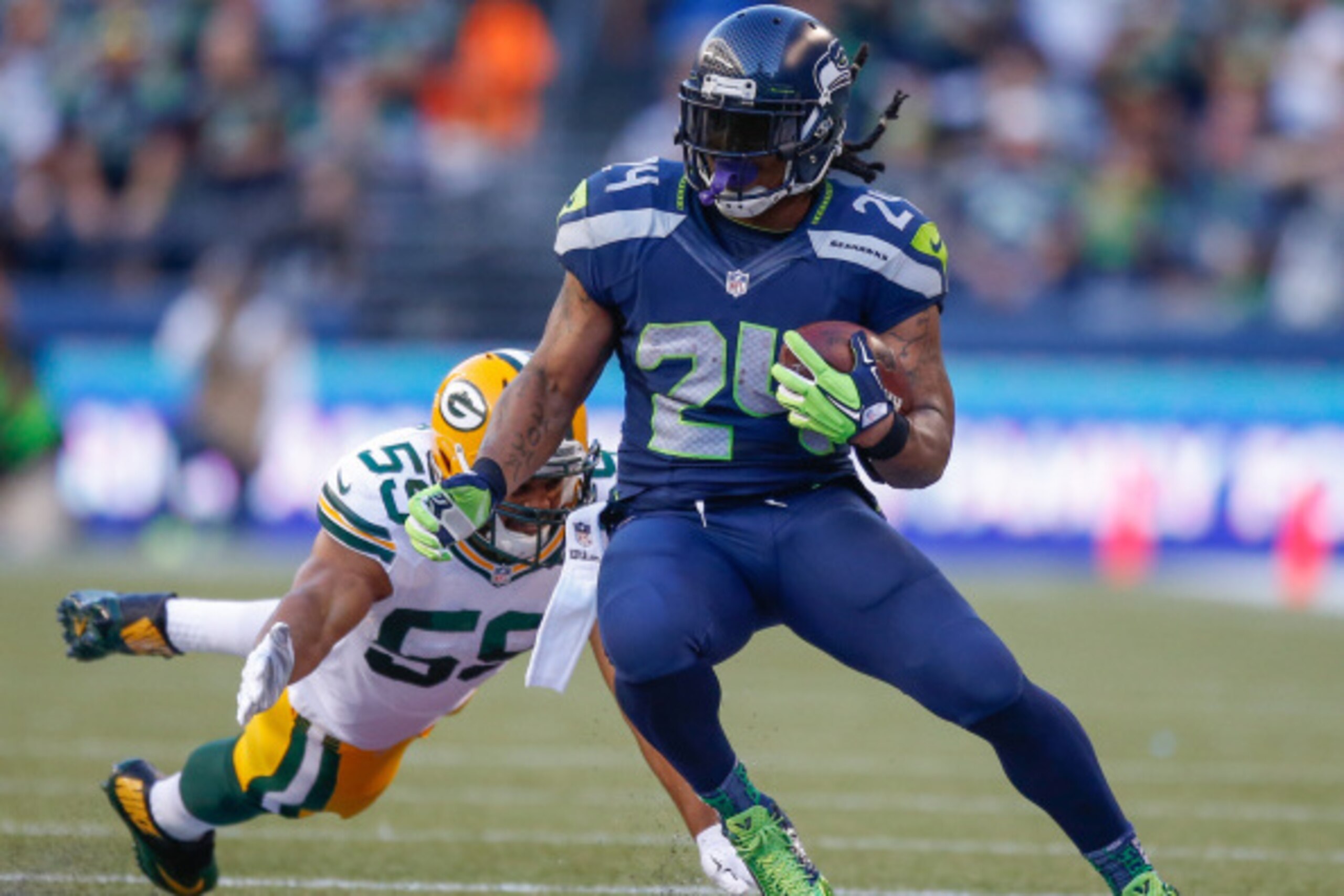 SEATTLE, WA - SEPTEMBER 04:  Running back Marshawn Lynch #24 of the Seattle Seahawks rushes against the Green Bay Packers at CenturyLink Field on September 4, 2014 in Seattle, Washington.  (Photo by Otto Greule Jr/Getty Images)