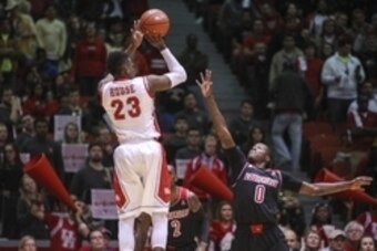 Feb 5, 2014; Houston, TX, USA; Houston Cougars forward Danuel House (23) shoots during the first half as Louisville Cardinals guard Terry Rozier (0) defends at Hofheinz Pavilion. Mandatory Credit: Troy Taormina-USA TODAY Sports