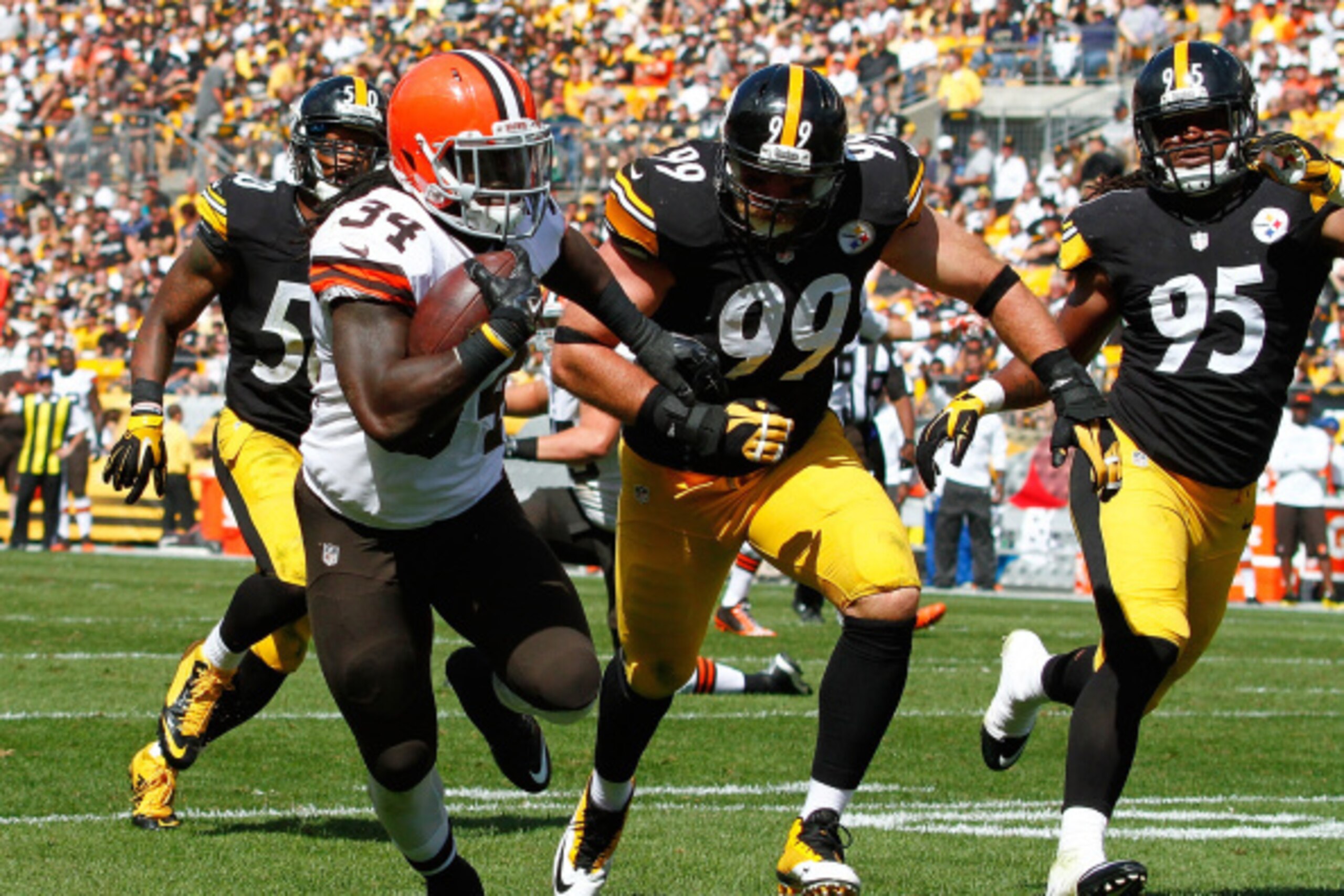 PITTSBURGH, PA - SEPTEMBER 7:  Isaiah Crowell #34 of the Cleveland Browns carries the ball for a touchdown in front of Brett Keisel #99 and Jarvis Jones #95 of the Pittsburgh Steelers during the third quarter at Heinz Field on September 7, 2014 in Pittsbu