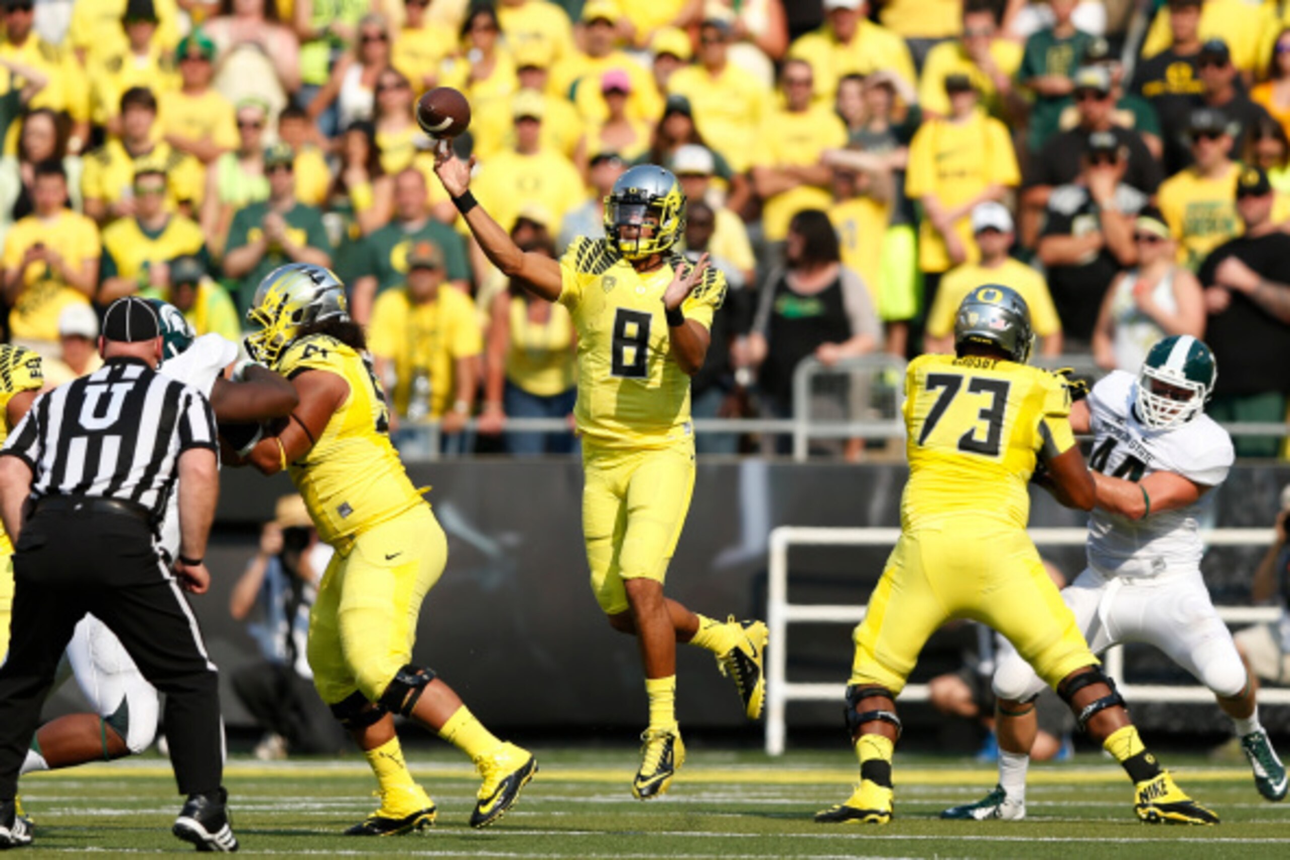 EUGENE, OR - SEPTEMBER 6: Marcus Mariota #8 of the Oregon Ducks passes the ball in the first half of the game against the Michigan State Spartans at Autzen Stadium on September 6, 2014 in Eugene, Oregon. (Photo by Joe Robbins/Getty Images)