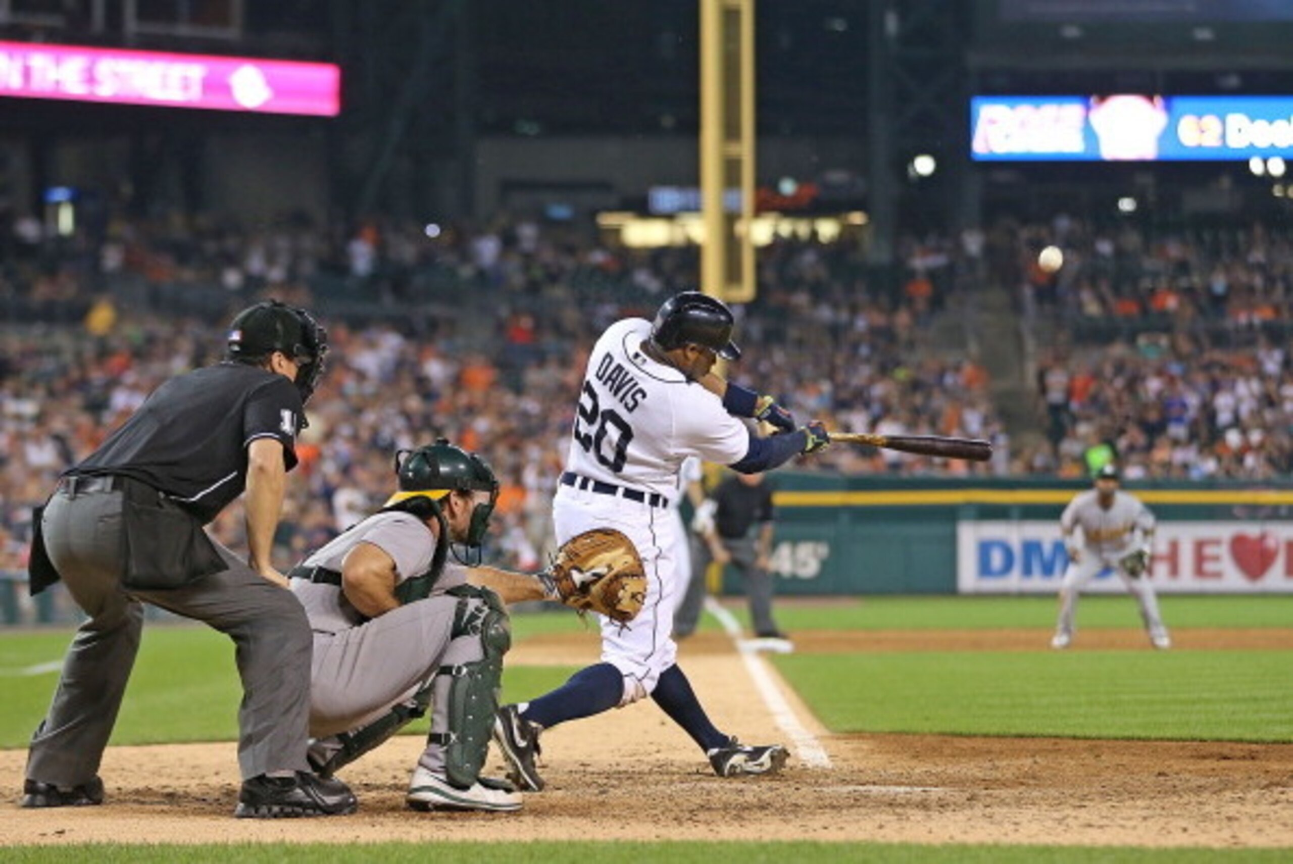 DETROIT, MI - JUNE 30:  Rajai Davis #20 of the Detroit Tigers hits a ninth-inning grand slam to win the game over the Oakland Athletics at Comerica Park on June 30, 2014 in Detroit, Michigan. The Tigers defeated the Athletics 5-4.  (Photo by Leon Halip/Ge
