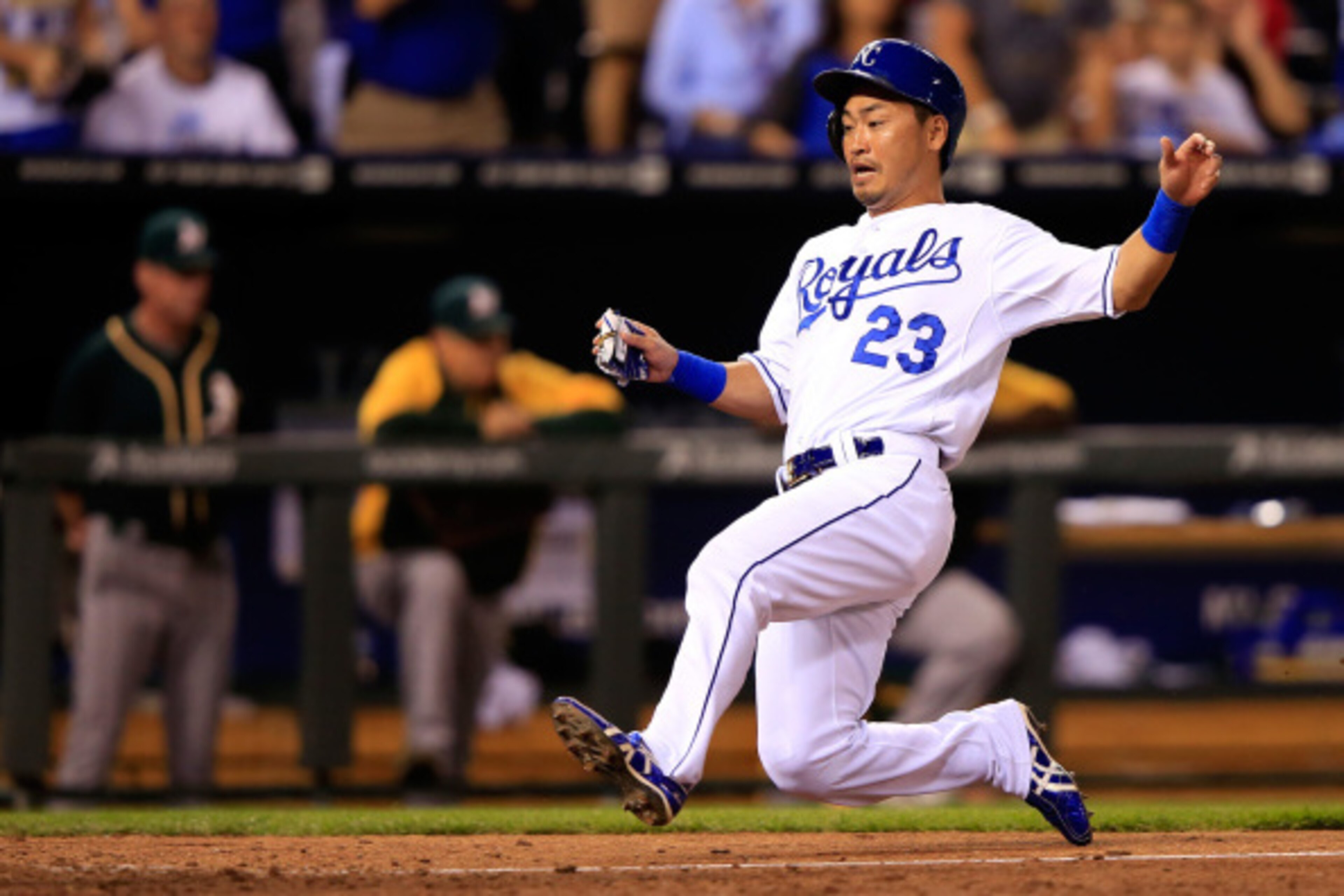 KANSAS CITY, MO - AUGUST 11: Norichika Aoki #23 of the Kansas City Royals slides safely into home plate to score during the 7th inning of the game against the Oakland Athletics at Kauffman Stadium on August 11, 2014 in Kansas City, Missouri. (Photo by J KANSAS CITY, MO - AUGUST 11: Norichika Aoki #23 of the Kansas City Royals slides safely into home plate to score during the 7th inning of the game against the Oakland Athletics at Kauffman Stadium on August 11, 2014 in Kansas City, Missouri. (Photo by J