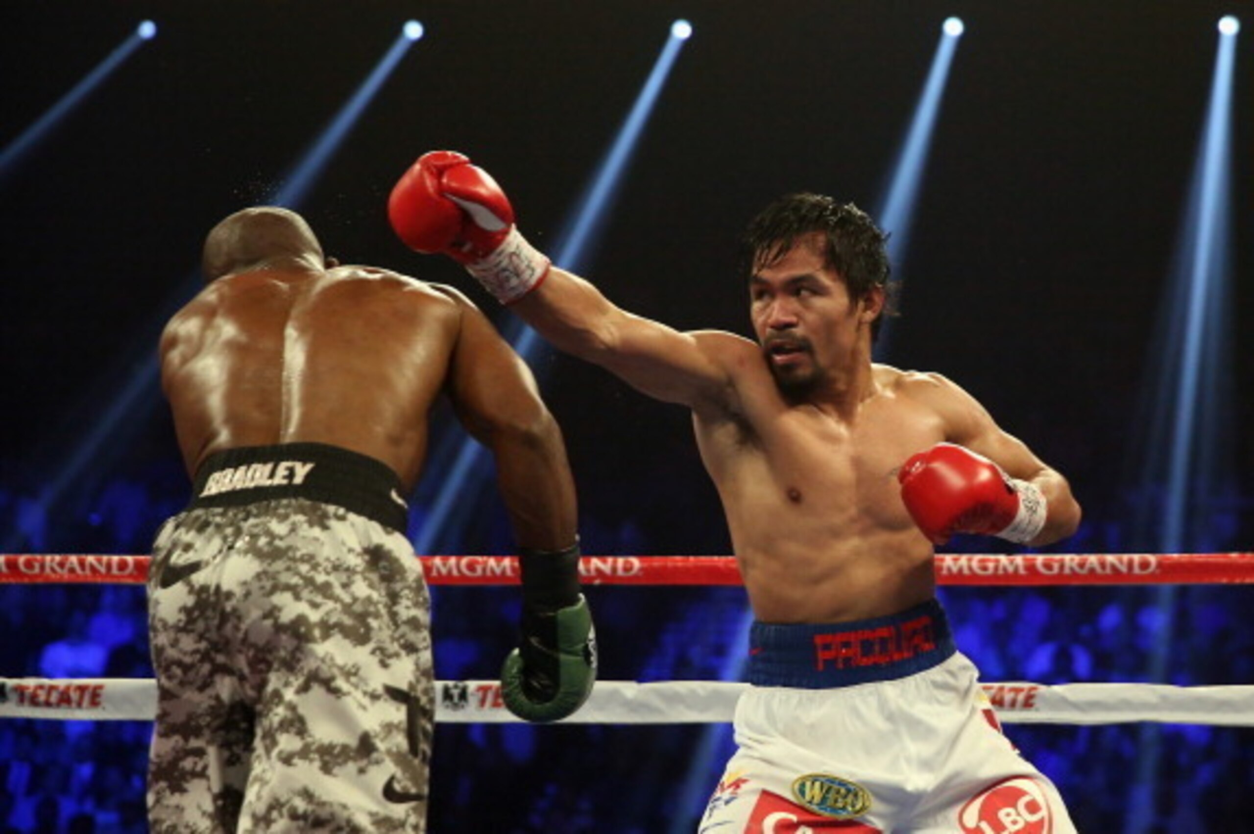 LAS VEGAS, NV - APRIL 12:  Manny Pacquiao throws a right hand at Timothy Bradley at the MGM Grand Garden Arena on April 12, 2014 in Las Vegas, Nevada.  (Photo by Jeff Gross/Getty Images)