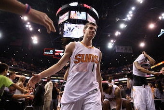PHOENIX, AZ - APRIL 14:  Goran Dragic #1 of the Phoenix Suns high fives fans as he walks off the court following the NBA game against the Memphis Grizzlies at US Airways Center on April 14, 2014 in Phoenix, Arizona.  The Grizzlies defeated the Suns 97-91.