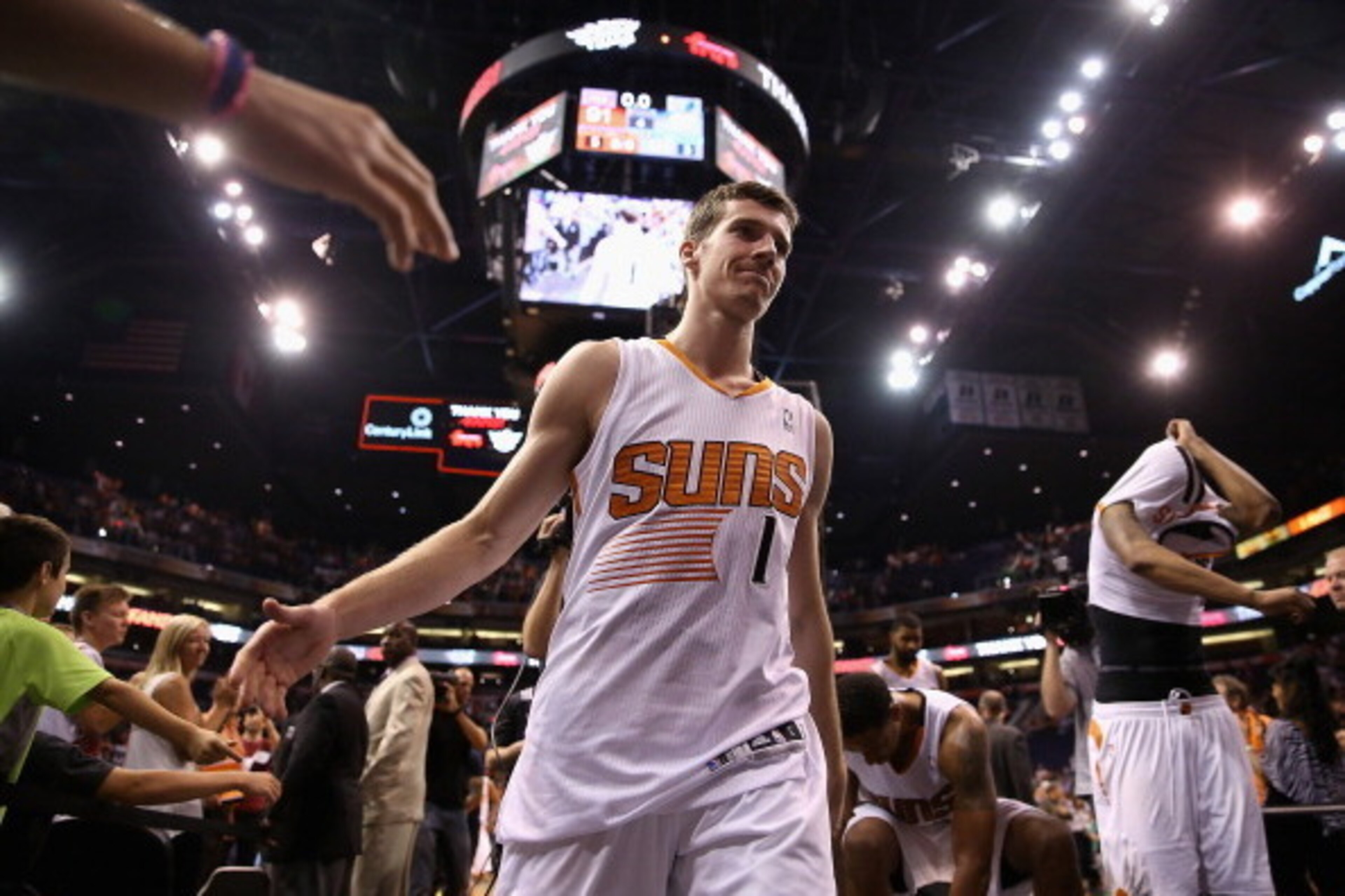 PHOENIX, AZ - APRIL 14:  Goran Dragic #1 of the Phoenix Suns high fives fans as he walks off the court following the NBA game against the Memphis Grizzlies at US Airways Center on April 14, 2014 in Phoenix, Arizona.  The Grizzlies defeated the Suns 97-91.
