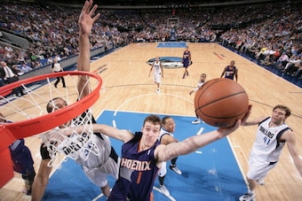 DALLAS, TX - APRIL 12: Goran Dragic #1 of the Phoenix Suns shoots against the Dallas Mavericks on April 12, 2014 at the American Airlines Center in Dallas, Texas. NOTE TO USER: User expressly acknowledges and agrees that, by downloading and or using this 