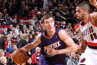 PORTLAND, OR - APRIL 4:  Goran Dragic #1 of the Phoenix Suns handles the ball against Nicolas Batum #88 of the Portland Trail Blazers on April 4, 2014 at the Moda Center Arena in Portland, Oregon. NOTE TO USER: User expressly acknowledges and agrees that,