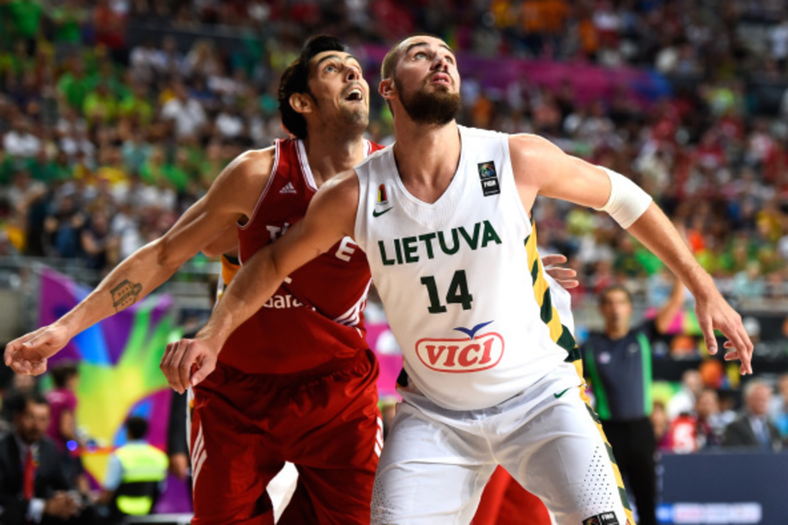 BARCELONA, SPAIN - SEPTEMBER 09:  Jonas Valanciunas #14 of the Lithuania Basketball Men's National Team and Kerem Gonlum #12 of the Turkey Basketball Men's National Team looks on  during 2014 FIBA Basketball World Cup quarter-final match between Lithuania