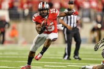 COLUMBUS, OH - SEPTEMBER 6:  Ezekiel Elliott #15 of the Ohio State Buckeyes runs with the ball  against the Virginia Tech Hokies at Ohio Stadium on September 6, 2014 in Columbus, Ohio.  (Photo by Jamie Sabau/Getty Images)