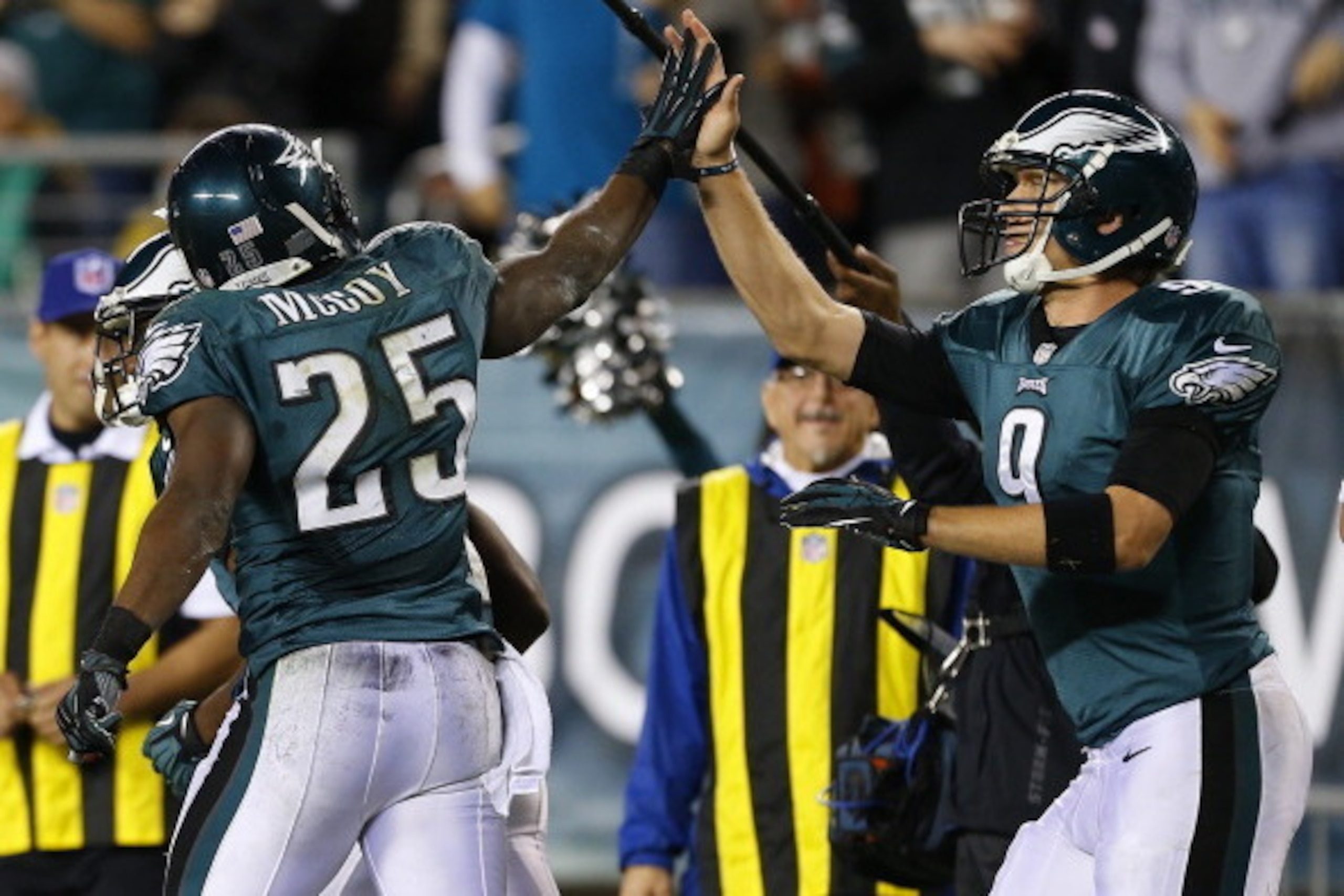 PHILADELPHIA, PA - DECEMBER 22: Running back LeSean McCoy #25 of the Philadelphia Eagles is congratulated by quarterback Nick Foles #9 after scoring a touchdown against the Chicago Bears in during the third quarter of a game at Lincoln Financial Field on 