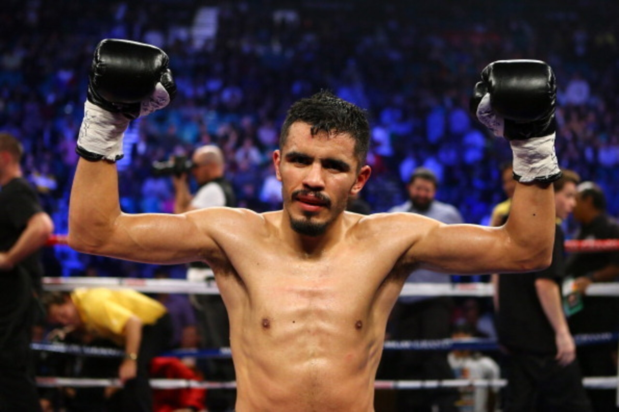LAS VEGAS, NV - DECEMBER 08:  (L-R) Miguel Angel Vazquez celebrates after the 12th round against Mercito Gesta after their IBF world lightweight title fight at the MGM Grand Garden Arena on December 8, 2012 in Las Vegas, Nevada. Vazquez defeated Gesta by 