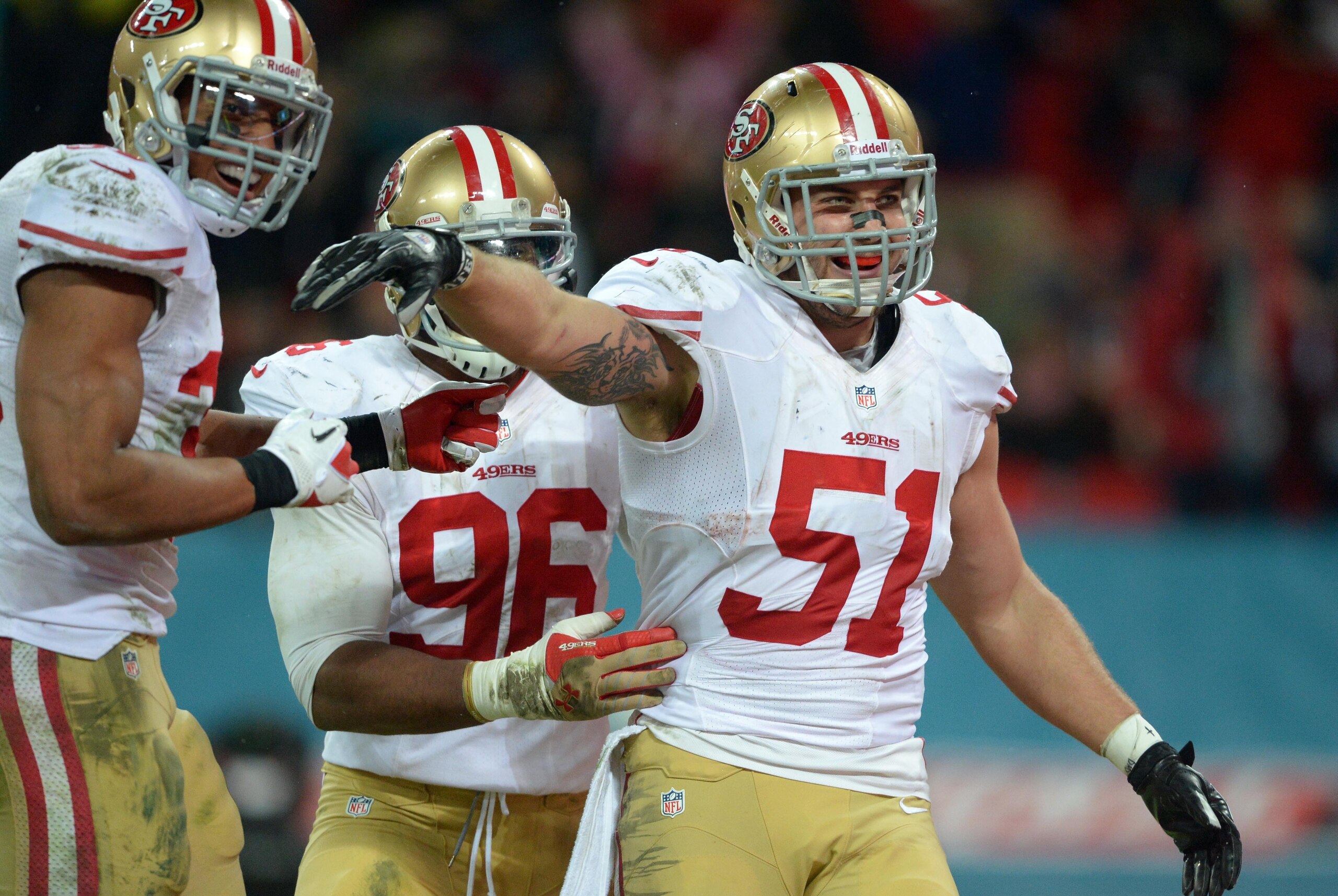 Oct 27, 2013; London, UNITED KINGDOM; San Francisco 49ers outside linebacker Dan Skuta (51) celebrates with teammates including Corey Lemonier (96) after scoring a touchdown on a fumble recovery return against the Jacksonville Jaguars in the second half d