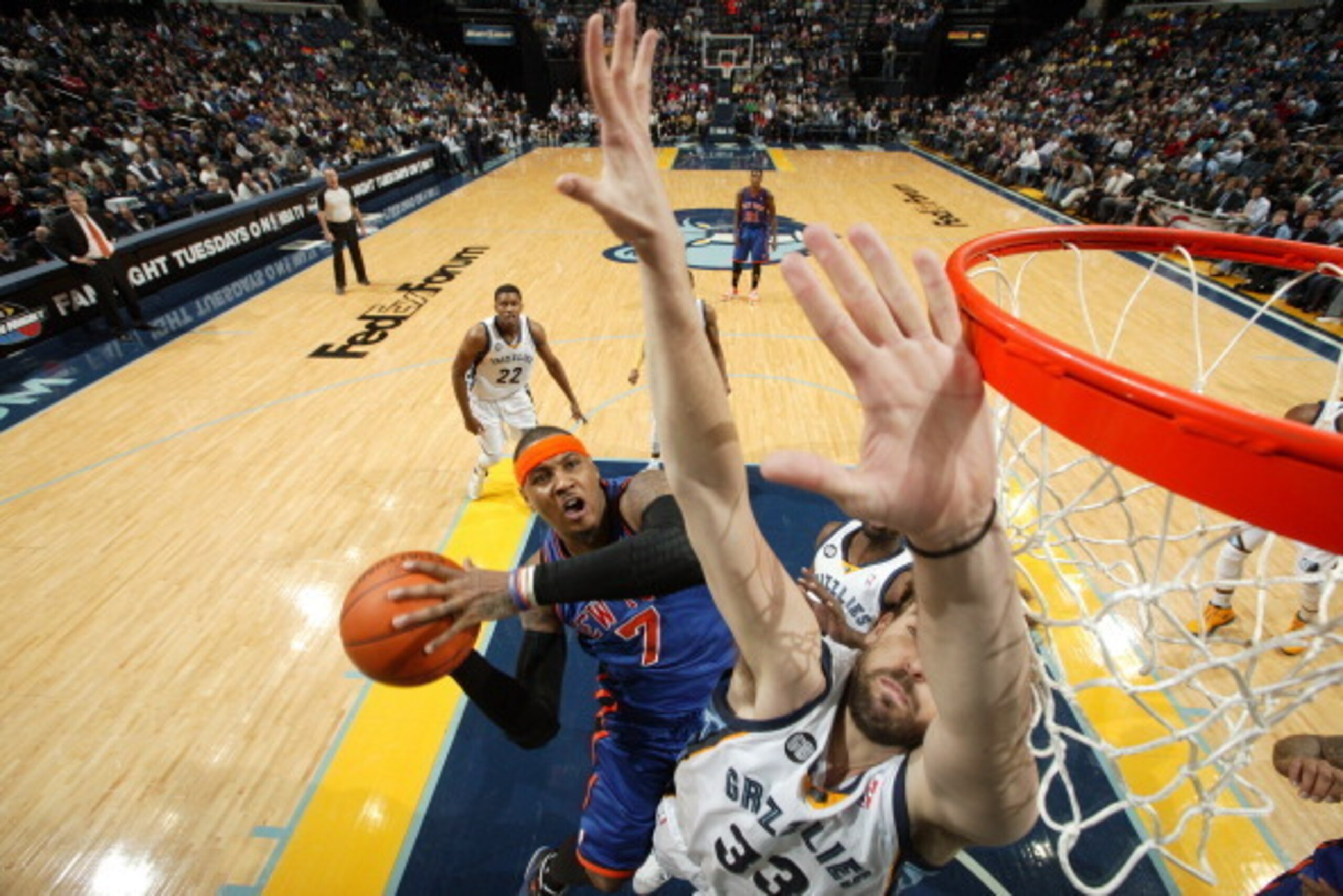 MEMPHIS, TN - JANUARY 12: Carmelo Anthony #7 of the New York Knicks shoots around Marc Gasol #33 of the Memphis Grizzlies on January 12, 2012 at FedExForum in Memphis, Tennessee.  NOTE TO USER: User expressly acknowledges and agrees that, by downloading a