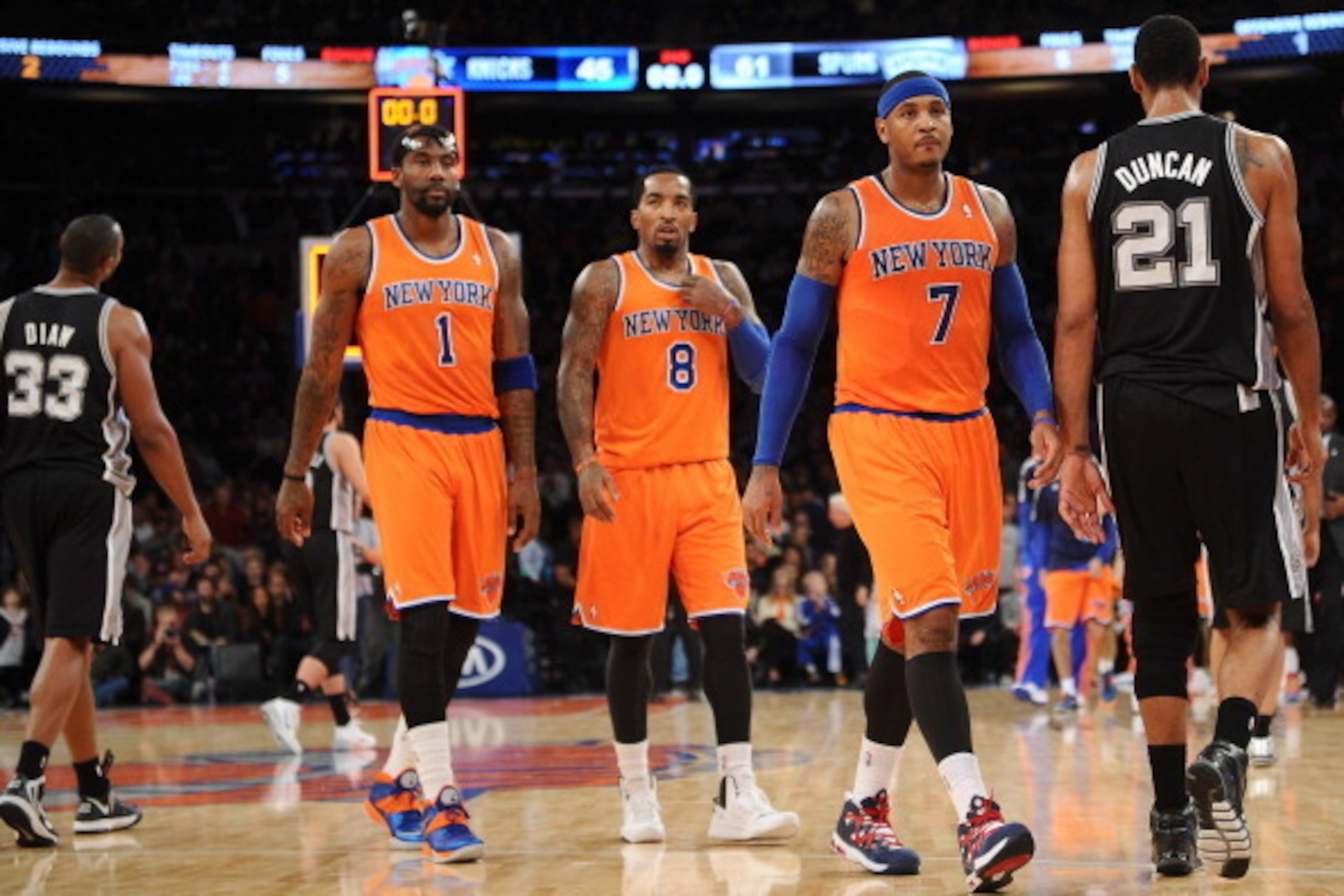 NEW YORK, NY - NOVEMBER 10:  Carmelo Anthony #7 of the New York Knicks and his teammates J.R. Smith #8 and Amar'e Stoudemire #1 walk into the locker room at half time against the San Antonio Spurs at Madison Square Garden on November 10, 2013 in New York 