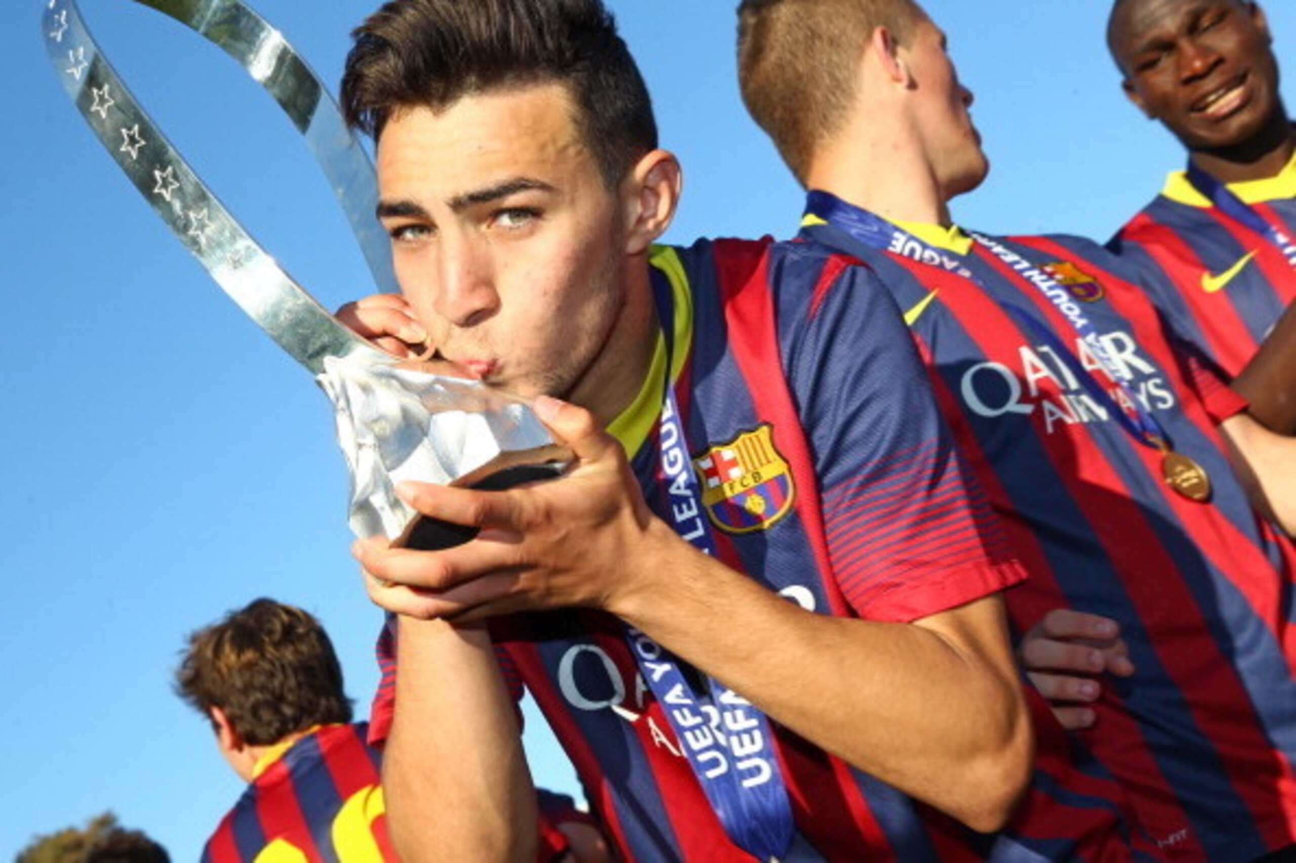 NYON, SWITZERLAND - APRIL 14: Munir El Haddadi of FC Barcelona kisses the Lennart Johansson trophy in celebration after victoy during the UEFA Youth League Final match between Benfica Lisbon and FC Barcelona at Colovray Stadion on April 14, 2014 in Nyon, 