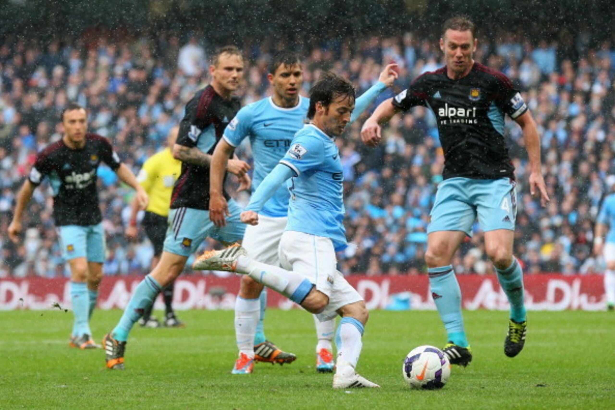 MANCHESTER, ENGLAND - MAY 11:   David Silva of Manchester City shoots at goal during the Barclays Premier League match between Manchester City and West Ham United at the Etihad Stadium on May 11, 2014 in Manchester, England.  (Photo by Alex Livesey/Getty 