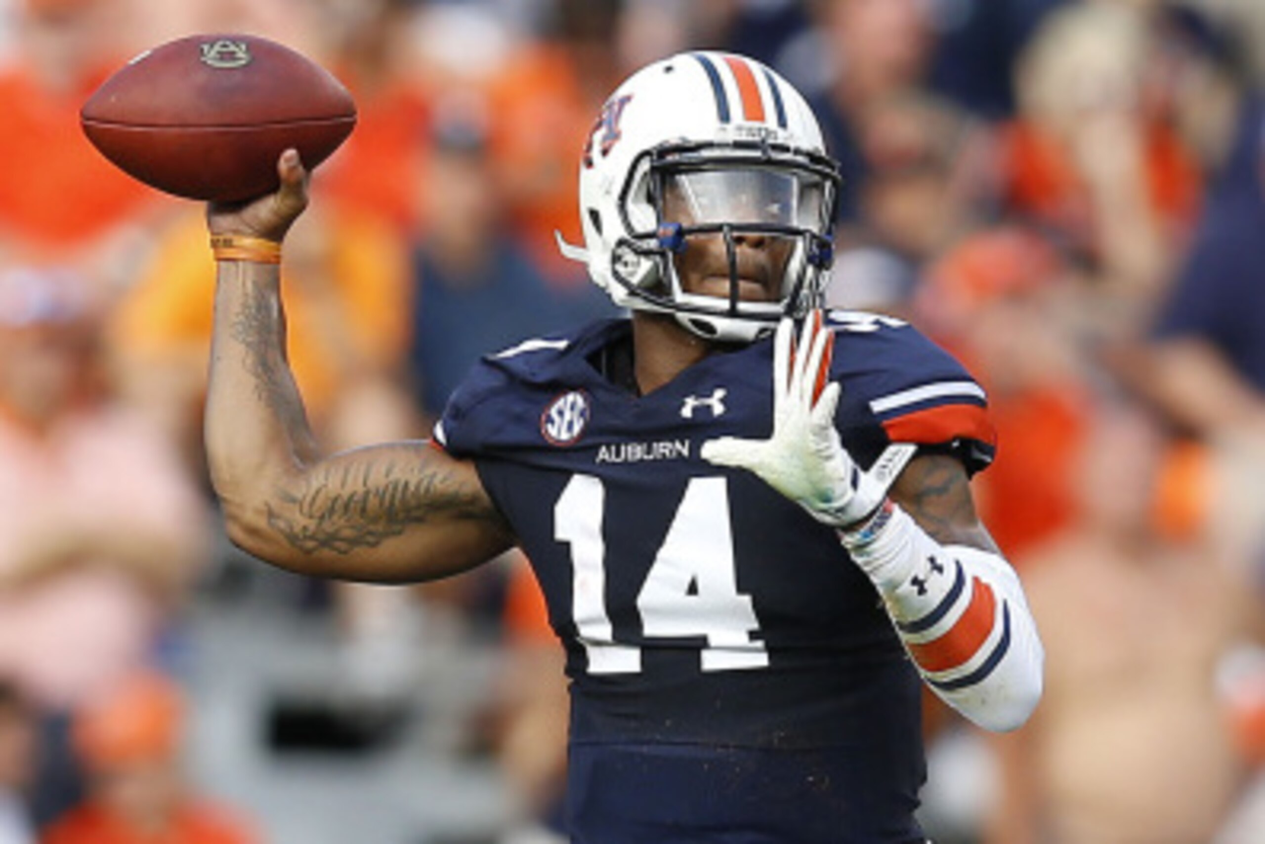AUBURN, AL - AUGUST 30:  Quarterback Nick Marshall #14 of the Auburn Tigers throws a pass during the game against the Arkansas Razorbacks at Jordan Hare Stadium on August 30, 2014 in Auburn, Alabama.  (Photo by Mike Zarrilli/Getty Images)