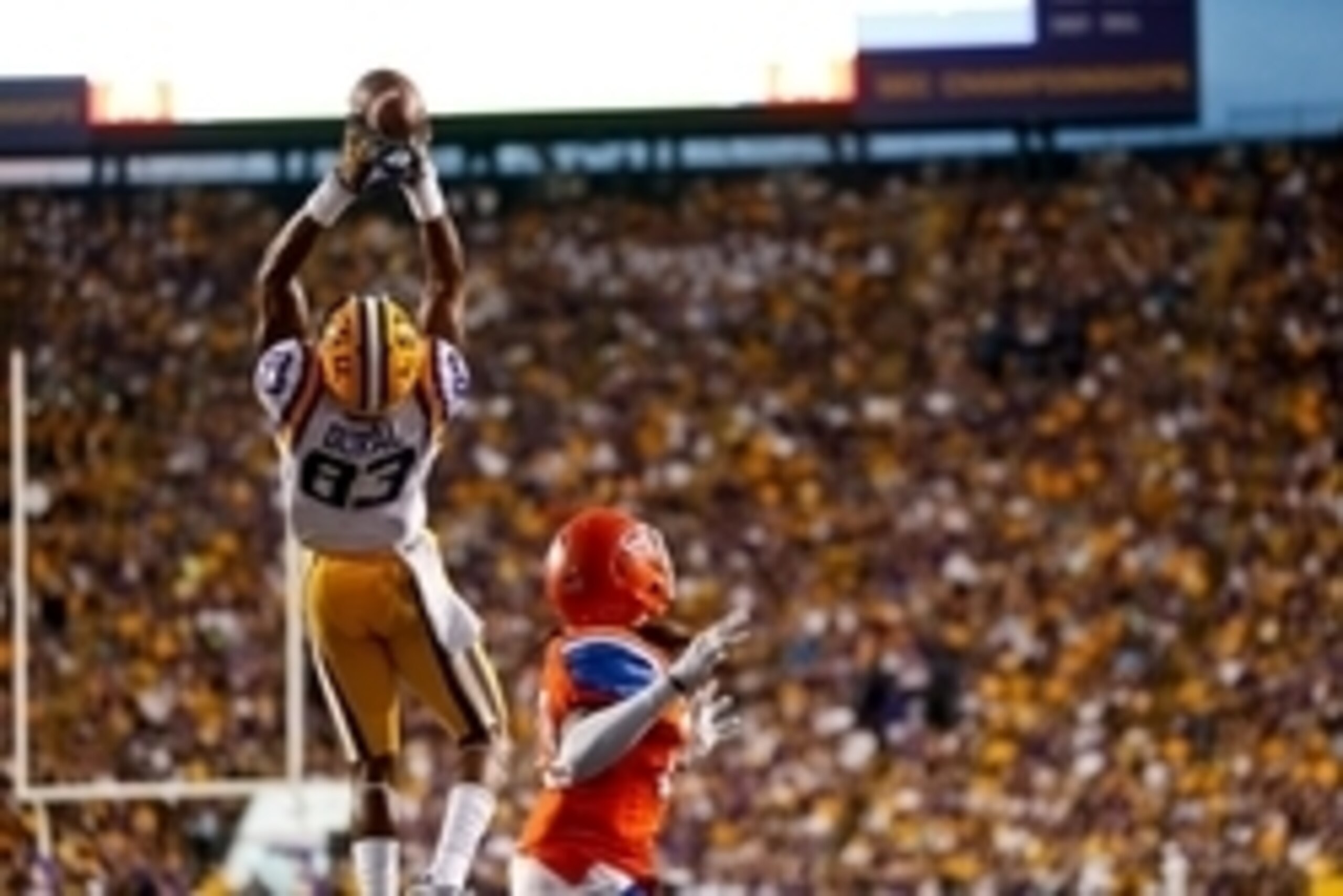 Sep 6, 2014; Baton Rouge, LA, USA; LSU Tigers wide receiver Travin Dural (83) catches a touchdown over Sam Houston State Bearkats cornerback Ernest Payton (20) during the first half of a game at Tiger Stadium. Mandatory Credit: Derick E. Hingle-USA TODAY 