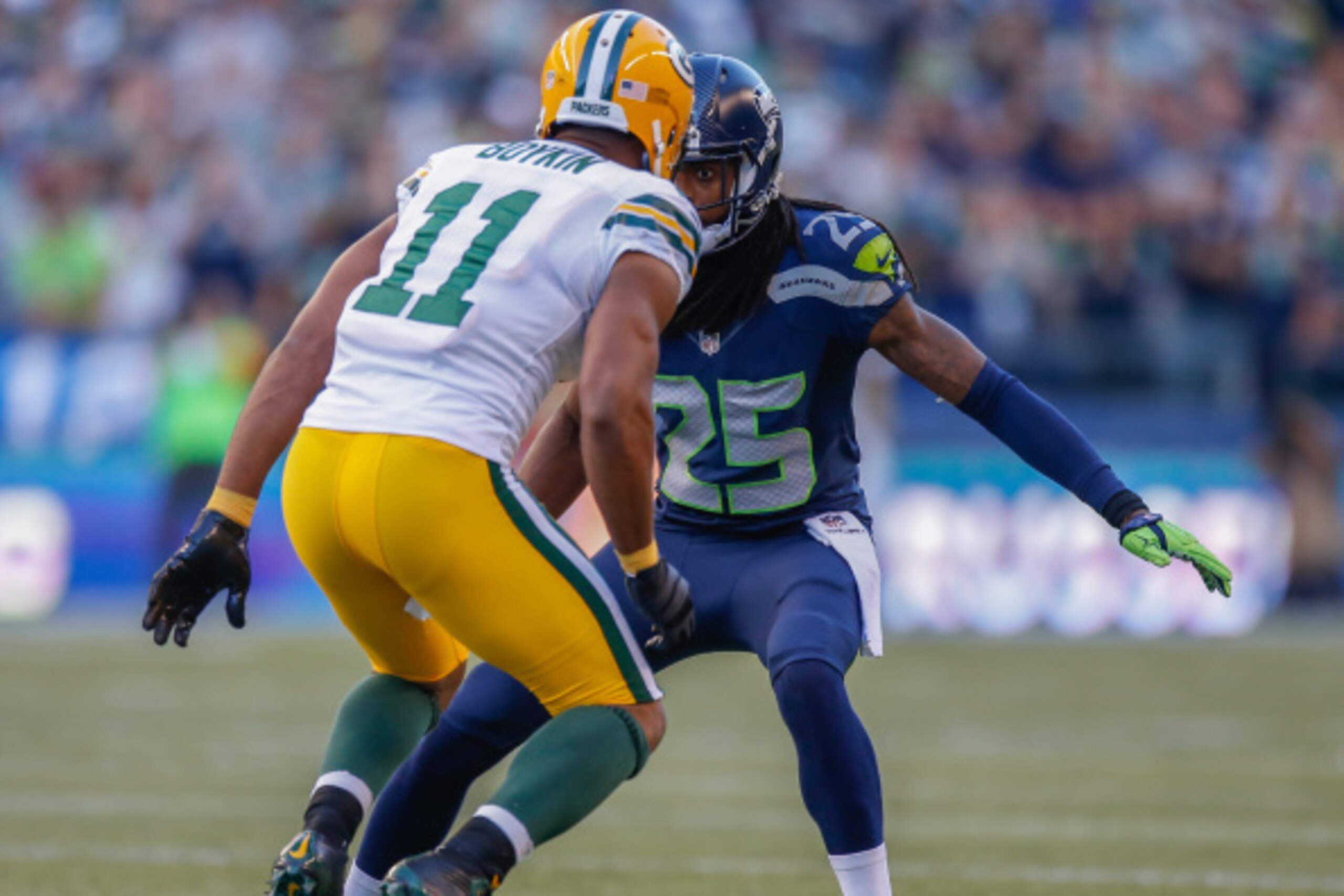 SEATTLE, WA - SEPTEMBER 04:  Cornerback Richard Sherman #25 of the Seattle Seahawks defends against wide receiver Jarrett Boykin #11 of the Green Bay Packers at CenturyLink Field on September 4, 2014 in Seattle, Washington.  (Photo by Otto Greule Jr/Getty