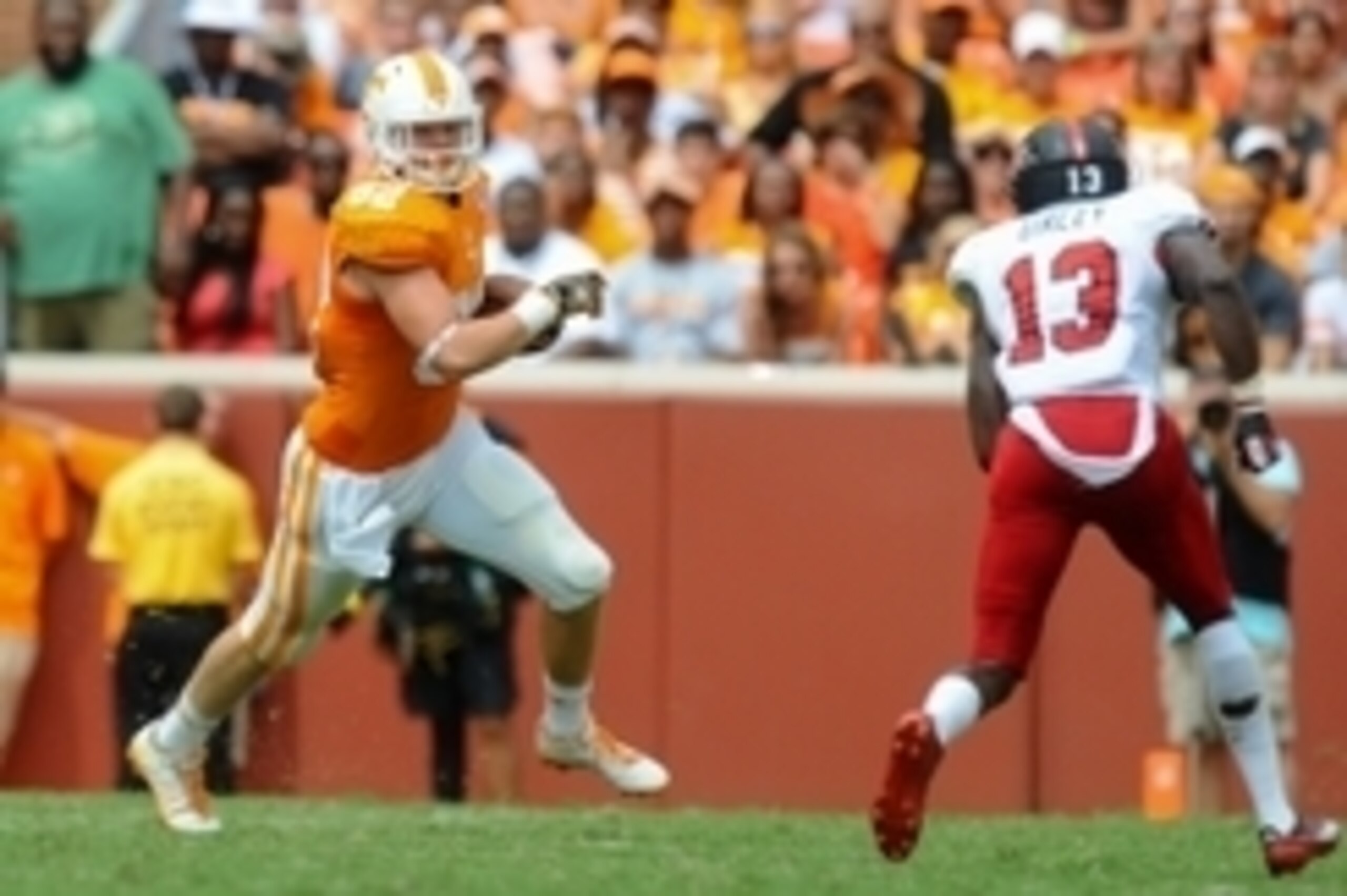 Sep 6, 2014; Knoxville, TN, USA; Tennessee Volunteers tight end Ethan Wolf (82) runs the ball against Arkansas State Red Wolves defensive back D.J. Armstead (13) during the second quarter at Neyland Stadium. Mandatory Credit: Randy Sartin-USA TODAY Sports
