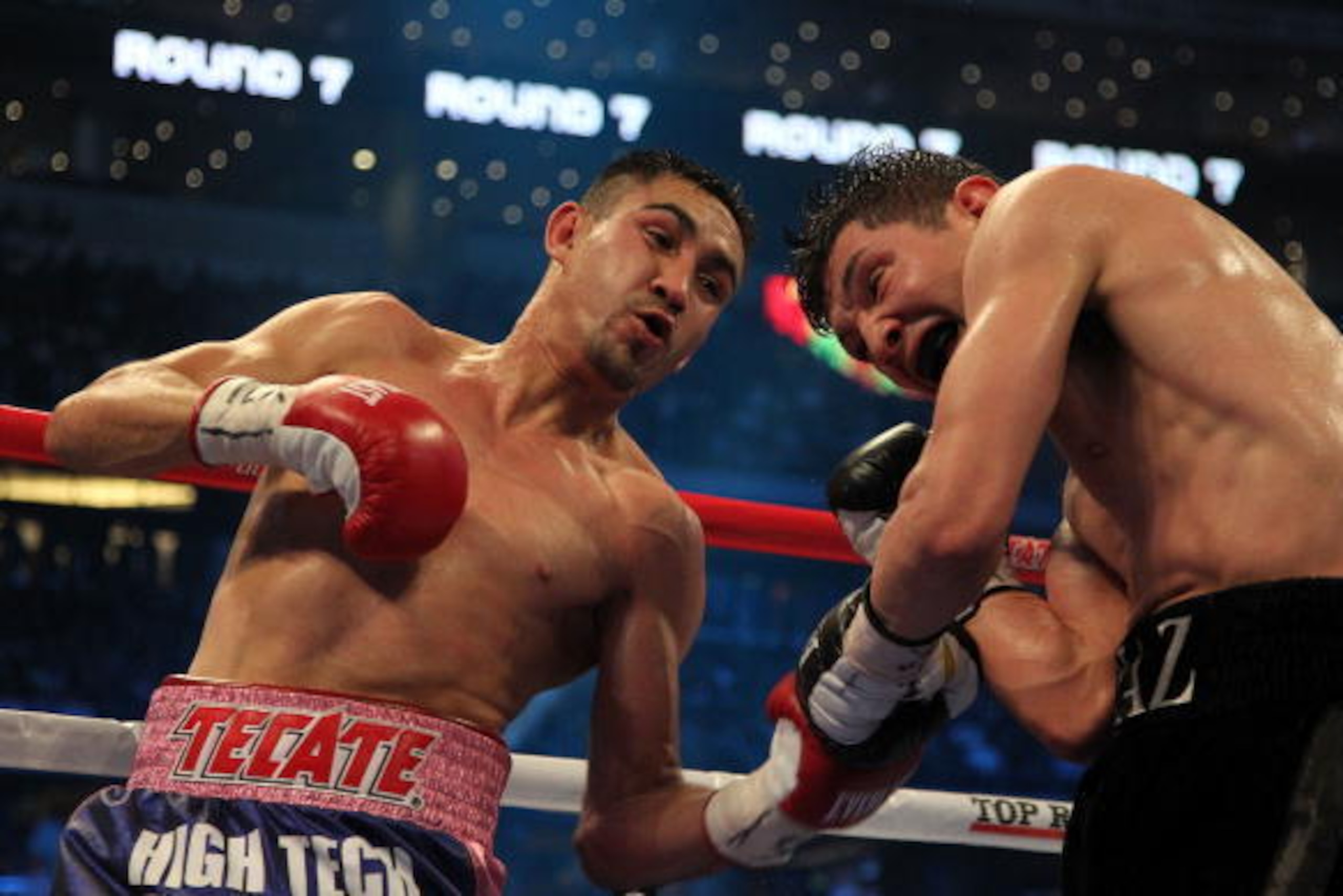 ARLINGTON, TX - MARCH 13:  (L-R) Humberto Soto of Mexico connects with a left to David Diaz in round seven during the WBC lightweight title fight at Cowboys Stadium on March 13, 2010 in Arlington, Texas. Soto defeated Diaz by decision. (Photo by Jed Jacob