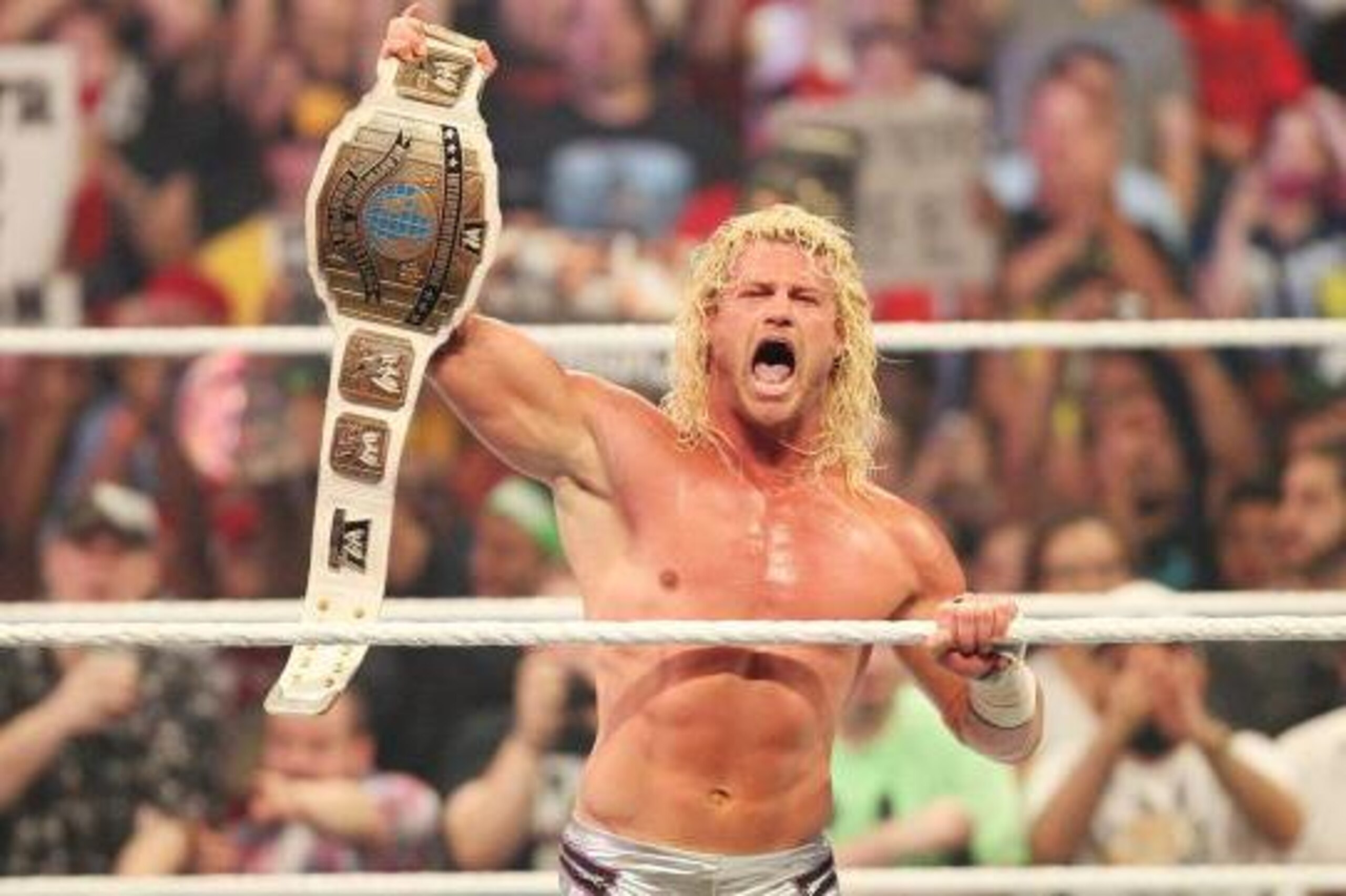 Dolph Ziggler celebrates winning the WWE Intercontinental Championship.