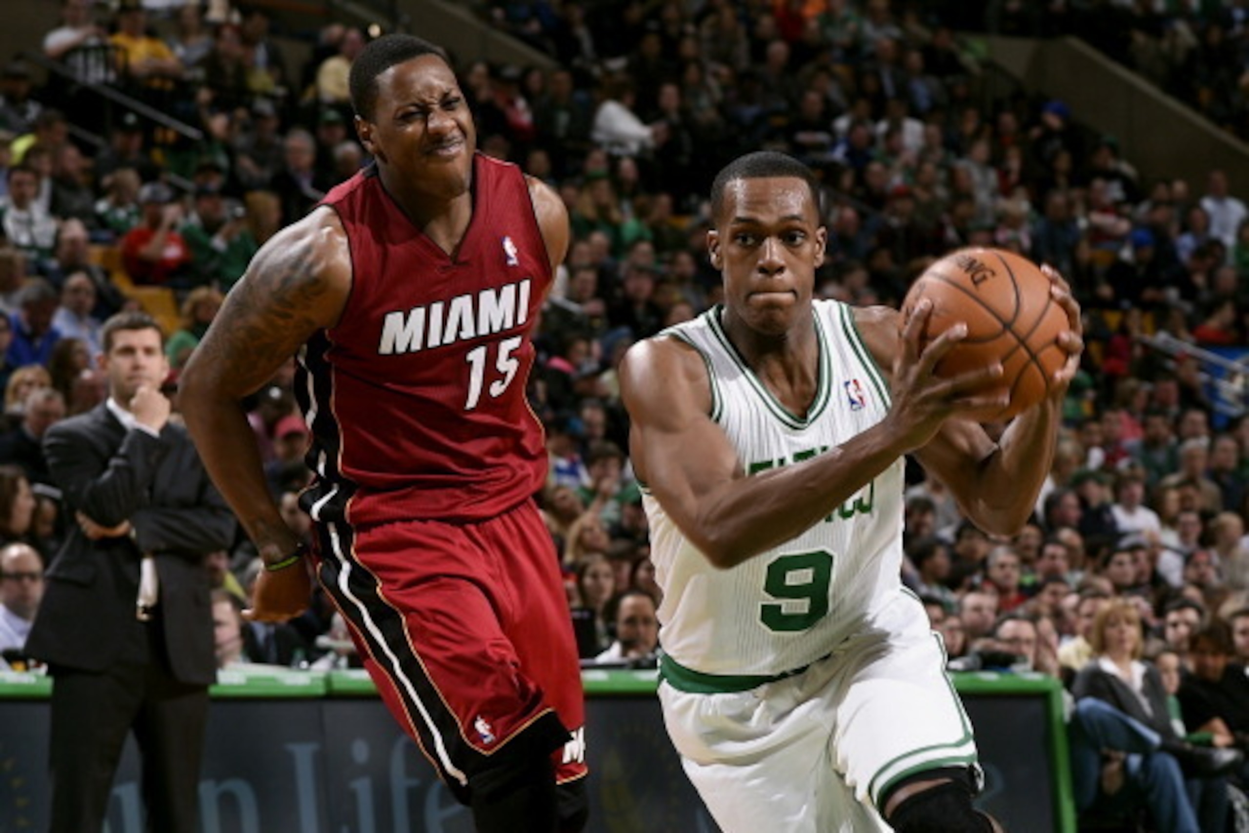 BOSTON, MA - MARCH 19: Rajon Rondo #9 of the Boston Celtics drives against Mario Chalmers #15 of the Miami Heat on March 19, 2014 at the TD Garden in Boston, Massachusetts.  NOTE TO USER: User expressly acknowledges and agrees that, by downloading and or 