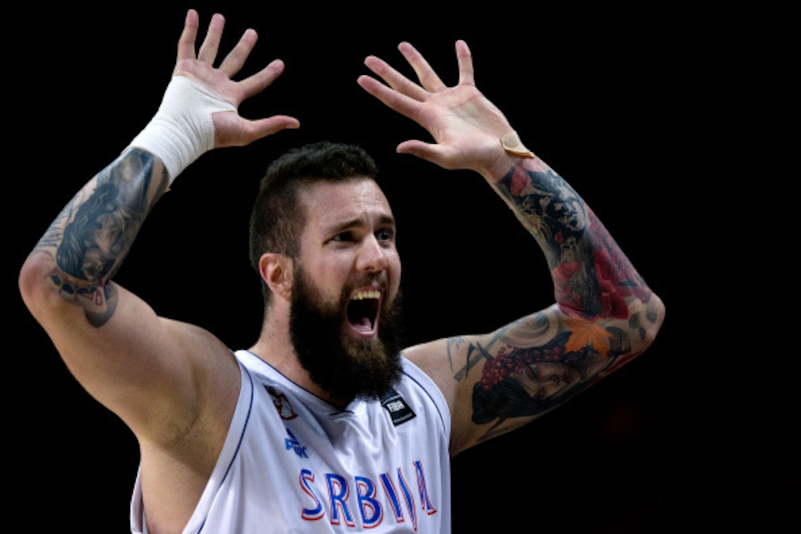 MADRID, SPAIN - SEPTEMBER 10: Miroslav Raduljica of Serbia celebrates their victory against Brazil during the 2014 FIBA World Basketball Championship quarter final match between Serbia and Brazil at Palacio de los Deportes on September 10, 2014 in Madrid,