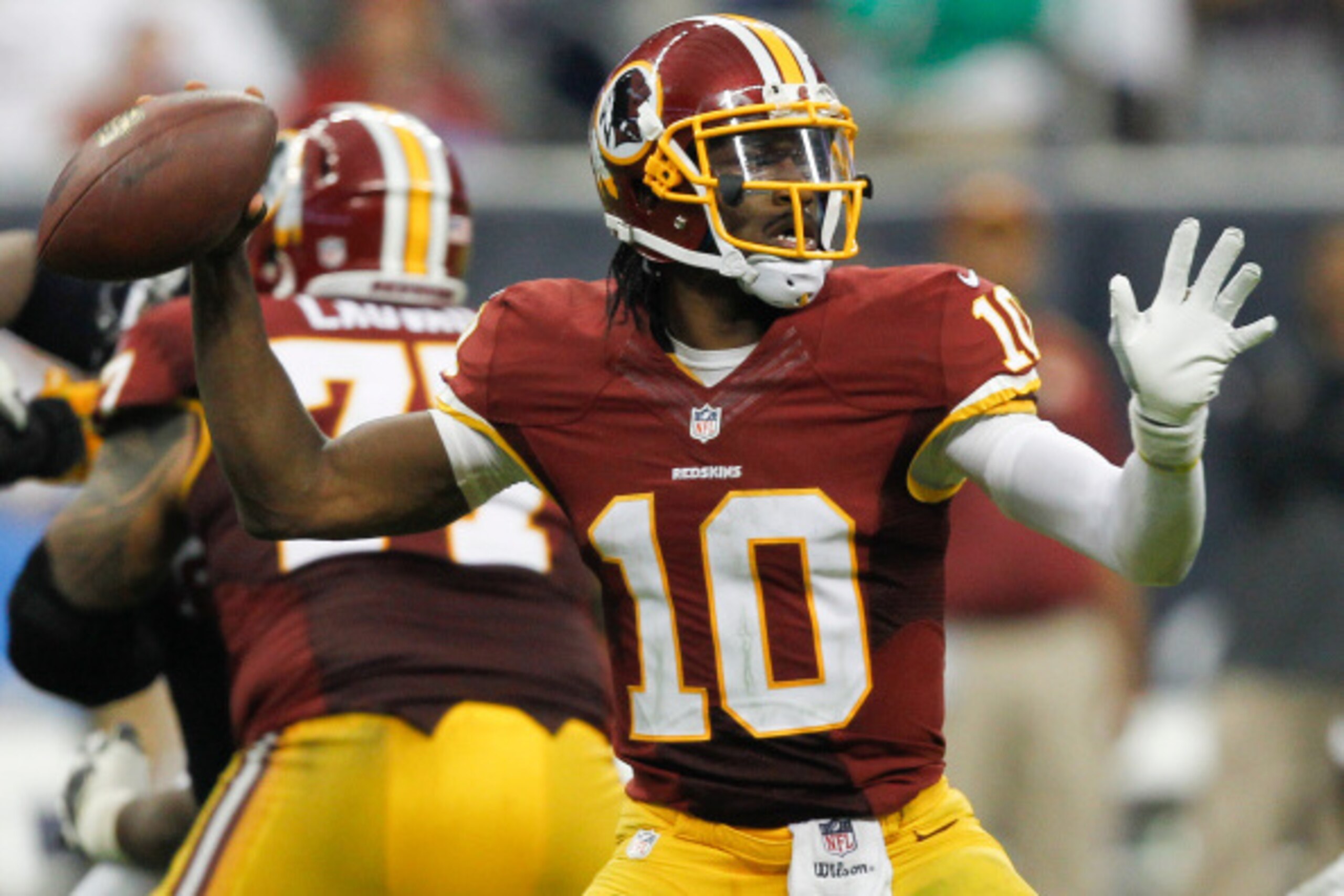 HOUSTON, TX - SEPTEMBER 07:  Robert Griffin III #10 of the Washington Redskins throws down-field in the fourth quarter against the Houston Texans at Reliant Stadium on September 7, 2014 in Houston, Texas.  (Photo by Bob Levey/Getty Images)
