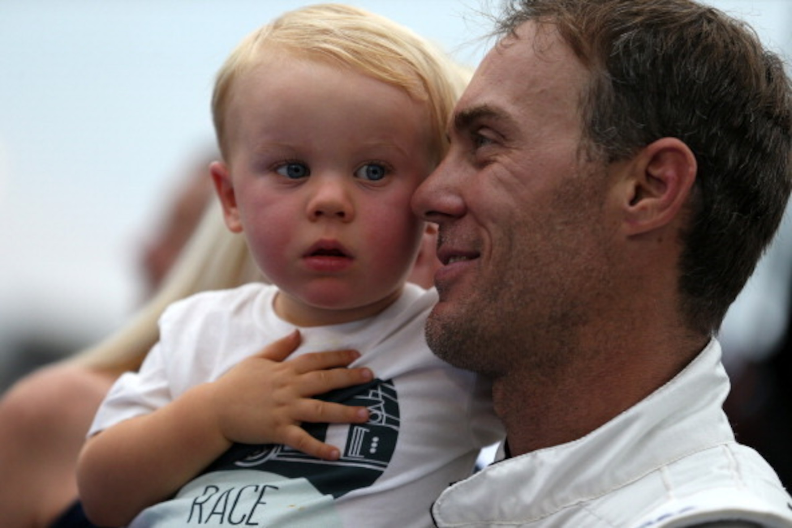 SPARTA, KY - JUNE 27:  Kevin Harvick, driver of the #5 Kroger/P&G Chevrolet, right, holds son Keelan during pre-race ceremonies for the NASCAR Nationwide Series John R. Elliott HERO Campaign 300 at Kentucky Speedway on June 27, 2014 in Sparta, Kentucky.  
