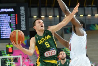 BARCELONA, SPAIN - SEPTEMBER 11: Adas Juskevicius #5 of the Lithuania National Team passes against the USA Basketball Men's National Team during the 2014 FIBA World Cup Semi-Finals at Palau Sant Jordi on September 11, 2014 in Barcelona, Spain.     NOTE TO