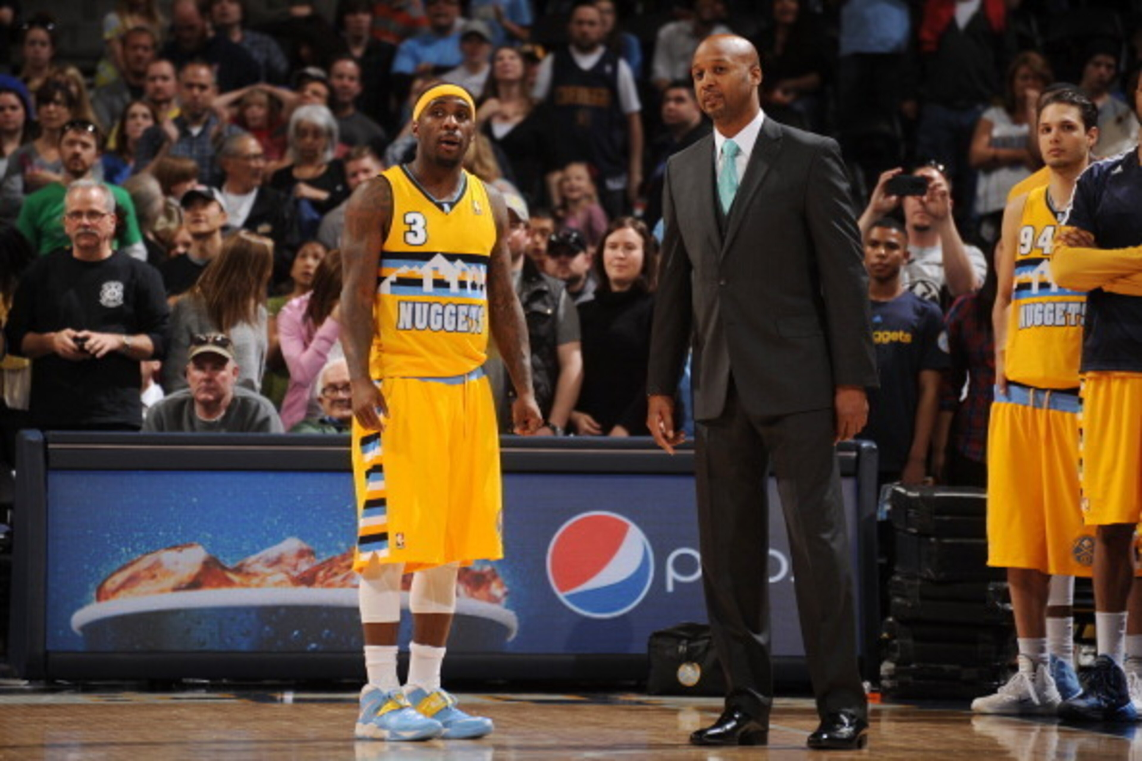 DENVER, CO - MARCH 23: Ty Lawson #3 and head coach Brian Shaw of the Denver Nuggets talk during a game against the Washington Wizards on March 23, 2014 at the Pepsi Center in Denver, Colorado. NOTE TO USER: User expressly acknowledges and agrees that, by 