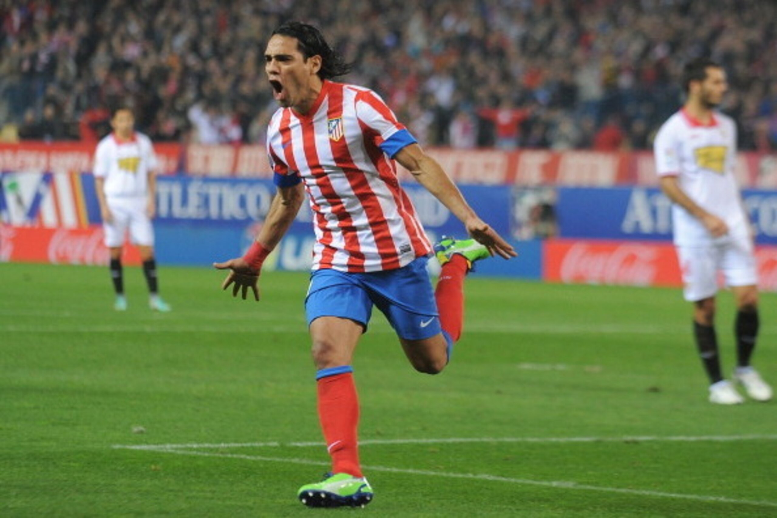 MADRID, SPAIN - NOVEMBER 25:  Radamel Falcao of Club Atletico de Madrid celebrates after scoring his team's opening goal during the La Liga match between Club Atletico de Madrid and Sevilla FC at Vicente Calderon Stadium on November 25, 2012 in Madrid, Sp