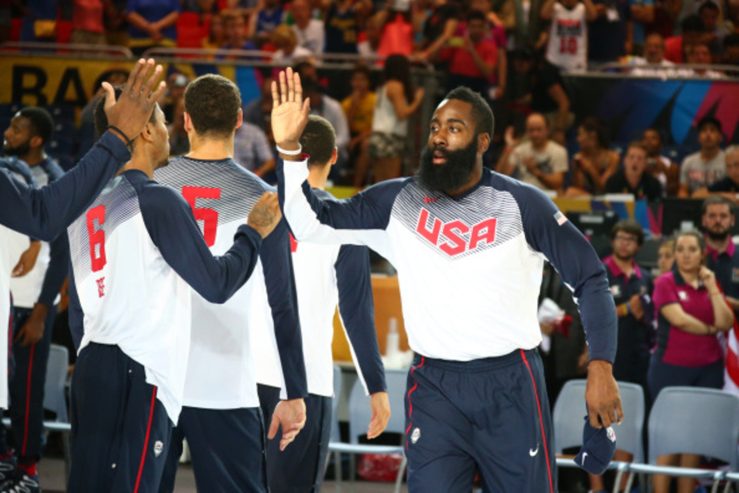 BILBAO, SPAIN - SEPTEMBER 4:  James Harden #13 of the USA Basketball Men's National Team high-fives teammates prior to playing a game against the Ukraine Basketball Men's National Team during the 2014 FIBA World Cup at Bizkaia Arena in Bilbao Exhibition C