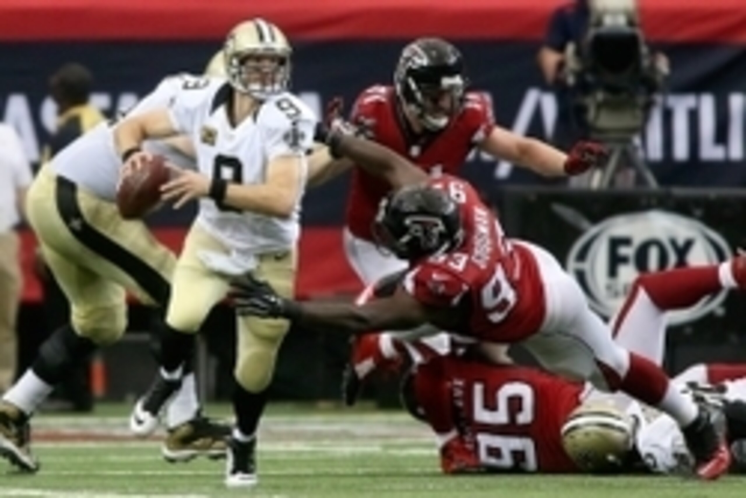 Sep 7, 2014; Atlanta, GA, USA; Atlanta Falcons defensive end Malliciah Goodman (93) pressures New Orleans Saints quarterback Drew Brees (9) in overtime of their game at the Georgia Dome. The Falcons won 37-34 in overtime. Mandatory Credit: Jason Getz-USA Sep 7, 2014; Atlanta, GA, USA; Atlanta Falcons defensive end Malliciah Goodman (93) pressures New Orleans Saints quarterback Drew Brees (9) in overtime of their game at the Georgia Dome. The Falcons won 37-34 in overtime. Mandatory Credit: Jason Getz-USA
