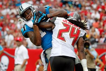 Sep 7, 2014; Tampa, FL, USA; Carolina Panthers wide receiver Kelvin Benjamin (13) catches the ball for a touchdown as Tampa Bay Buccaneers cornerback Mike Jenkins (24) as he was called for defensive pass interference during the second half at Raymond Jame