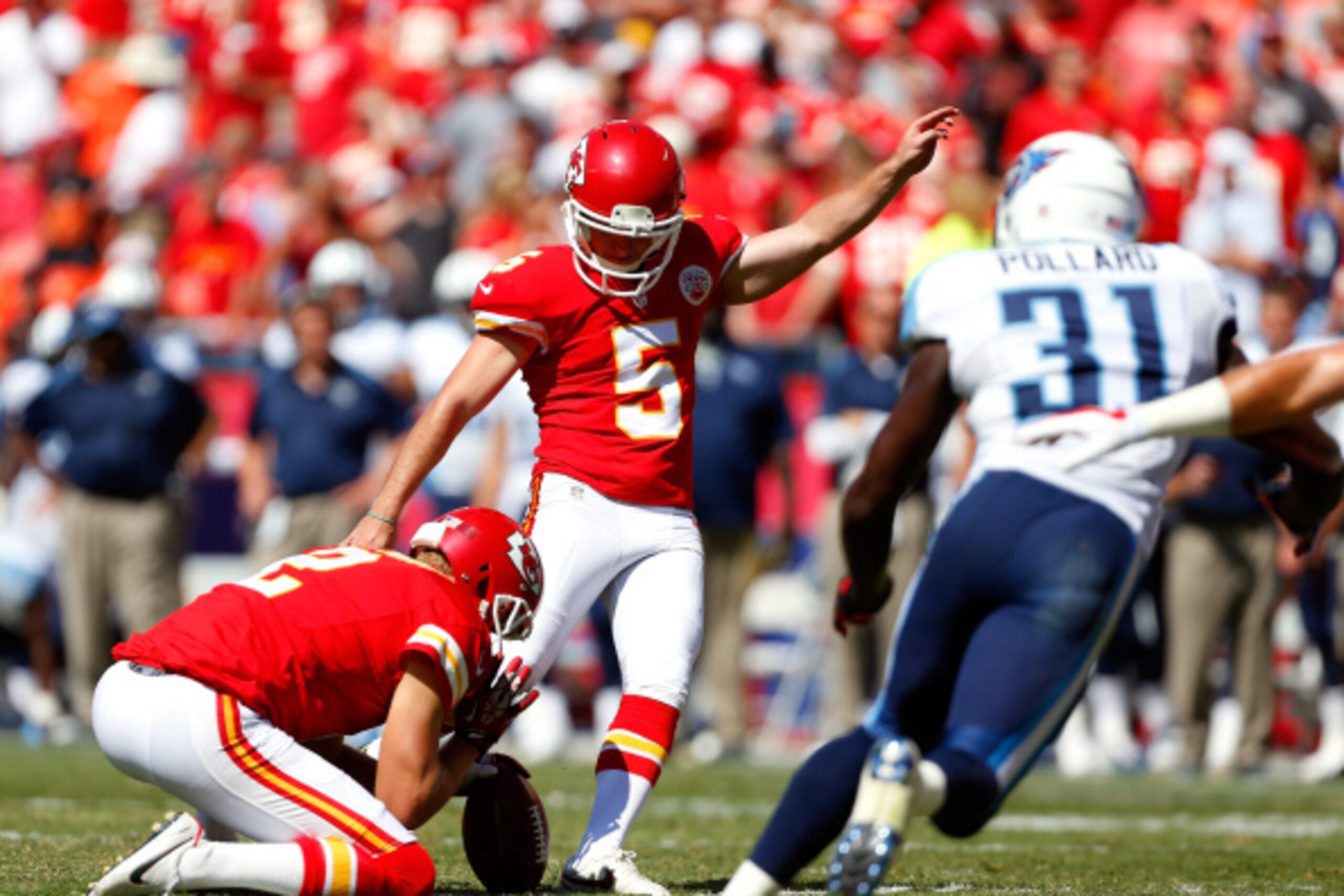 KANSAS CITY, MO - SEPTEMBER 07:   Cairo Santos #5 of the Kansas City Chiefs kicks the ball against the Tennessee Titans during the second half at Arrowhead Stadium on September 7, 2014 in Kansas City, Missouri.  (Photo by Wesley Hitt/Getty Images)