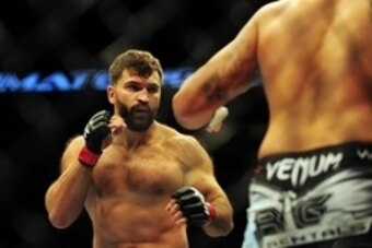 Jun 14, 2014; Vancouver, British Columbia, Canada; Andrei Arlovski (red) fights against Brendan Schuab (blue) in their heavyweight bout for UFC 174 at Rogers Arena. Mandatory Credit: Anne-Marie Sorvin-USA TODAY Sports