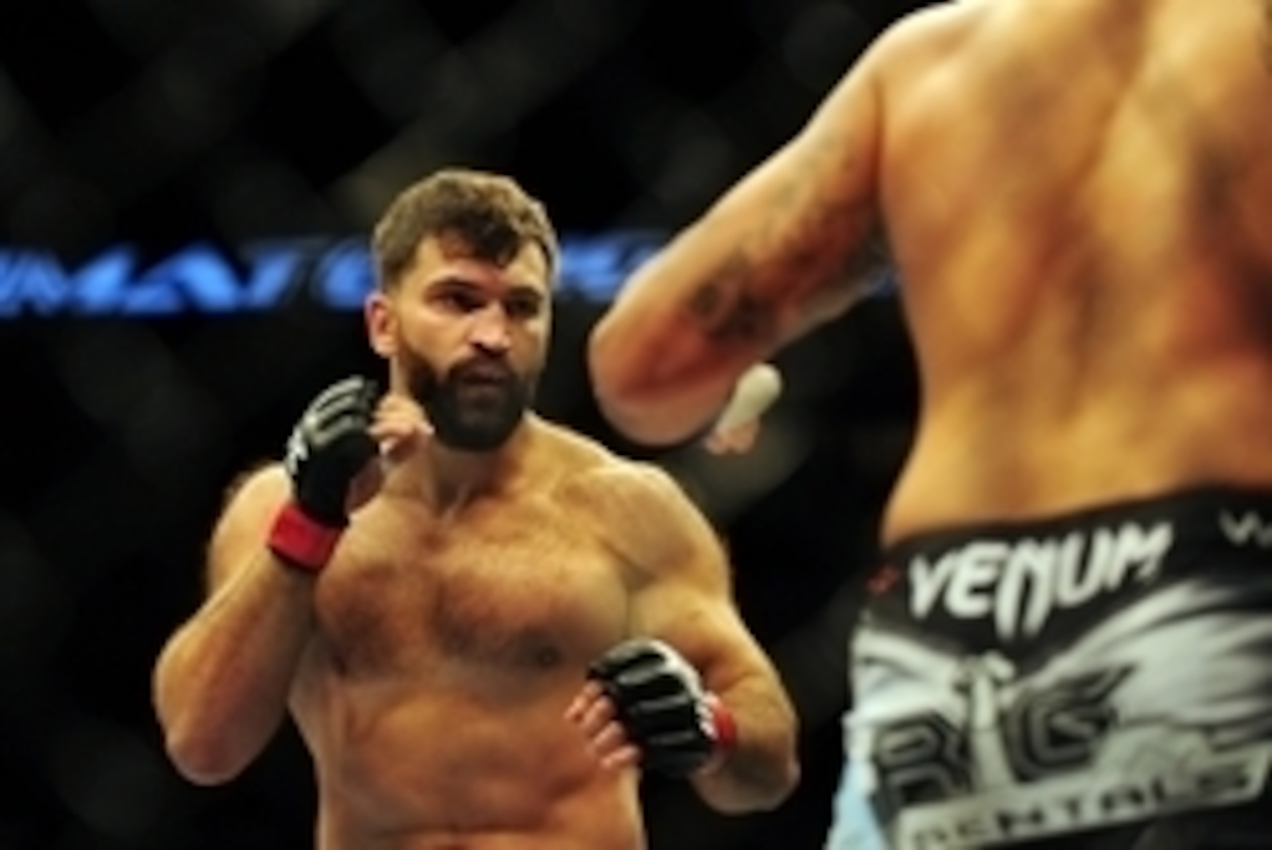 Jun 14, 2014; Vancouver, British Columbia, Canada; Andrei Arlovski (red) fights against Brendan Schuab (blue) in their heavyweight bout for UFC 174 at Rogers Arena. Mandatory Credit: Anne-Marie Sorvin-USA TODAY Sports