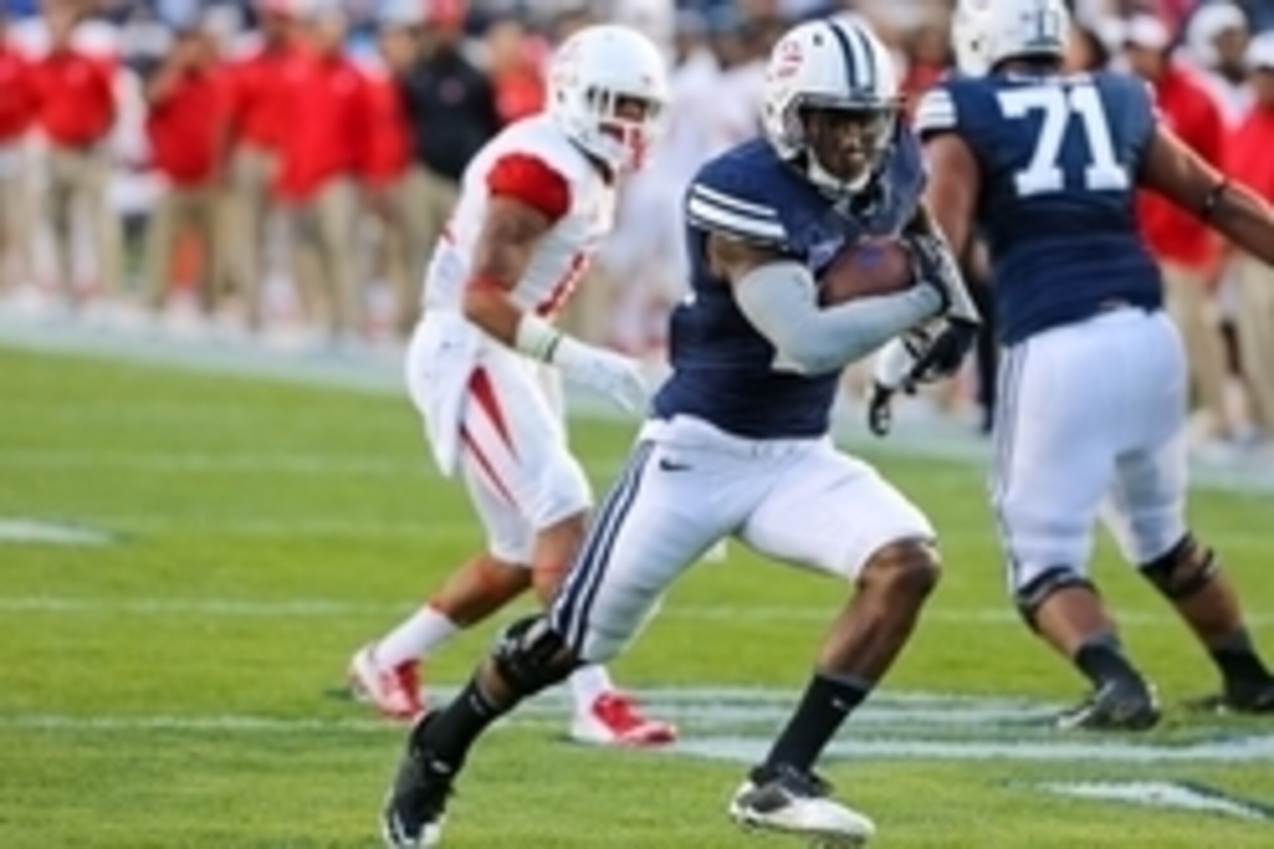 Sep 11, 2014; Provo, UT, USA; Brigham Young Cougars running back Jamaal Williams (21) runs the ball against the Houston Cougars during the first quarter at Lavell Edwards Stadium. Mandatory Credit: Chris Nicoll-USA TODAY Sports