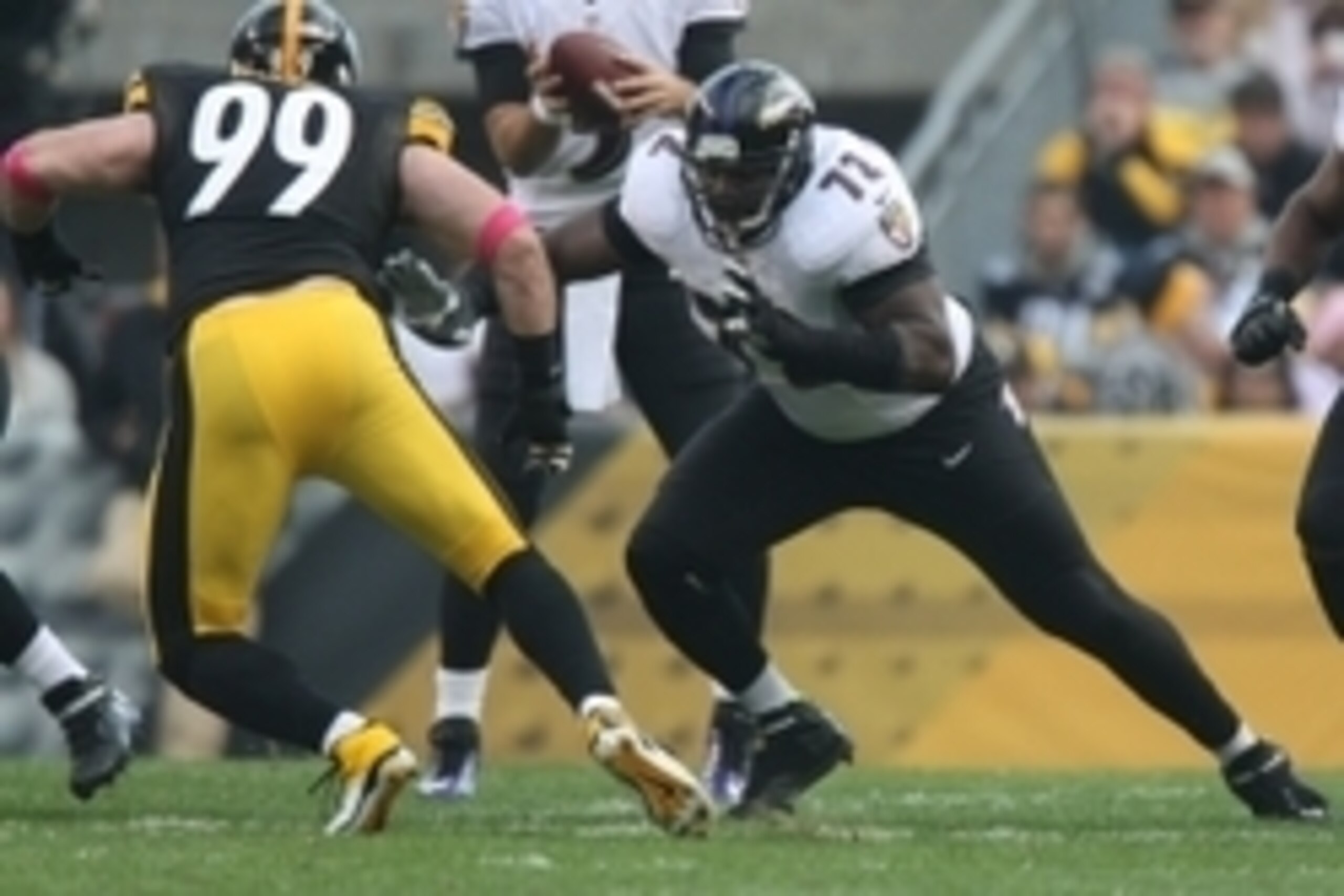 Oct 20, 2013; Pittsburgh, PA, USA; Baltimore Ravens guard Kelechi Osemele (72) blocks Pittsburgh Steelers defensive end Brett Keisel (99) during the first half at Heinz Field. Mandatory Credit: Jason Bridge-USA TODAY Sports