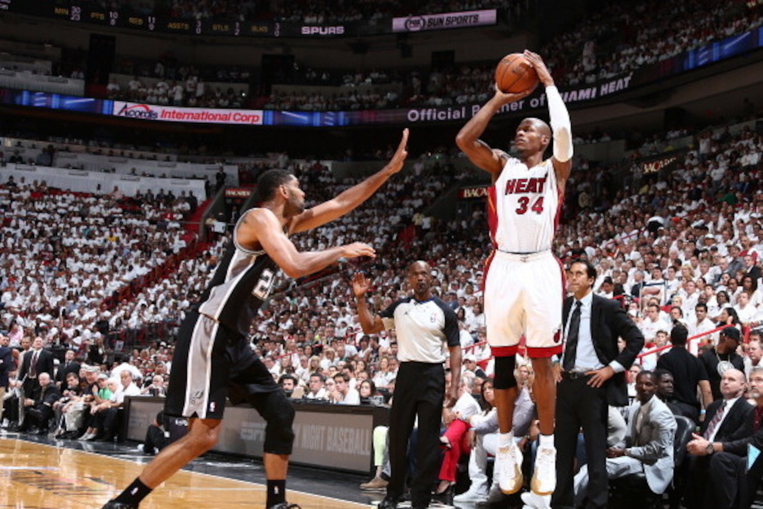 MIAMI, FL - JUNE 12: Ray Allen #34 of the Miami Heat shoots over Tim Duncan #21 of the San Antonio Spurs during Game Four of the 2014 NBA Finals at American Airlines Arena in Miami, Florida on June 12, 2014.  NOTE TO USER: User expressly acknowledges and 