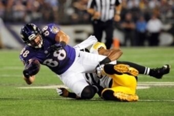 Sep 11, 2014; Baltimore, MD, USA; Baltimore Ravens tight end Dennis Pitta (88) gets tackled by Pittsburgh Steelers cornerback William Gay (22) in the first quarter at M&T Bank Stadium. Mandatory Credit: Evan Habeeb-USA TODAY Sports