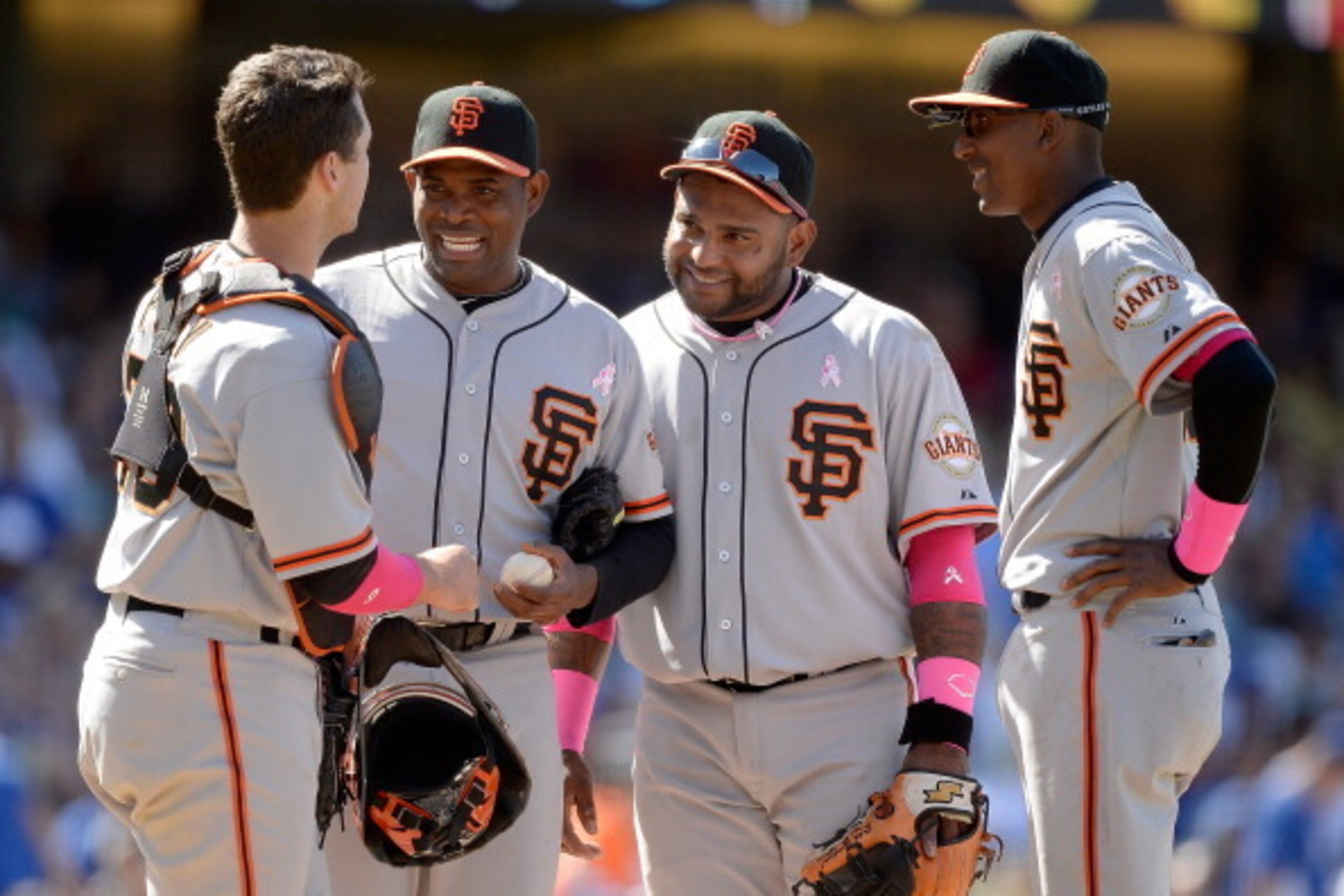 LOS ANGELES, CA - MAY 11:  (L-R) Buster Posey #28, Santiago Casilla #46, Pablo Sandoval #48 and Joaquin Arias #13 of the San Francisco Giants laugh on the mound with a 4-2 lead during the eighth inning against the Los Angeles Dodgers at Dodger Stadium on 