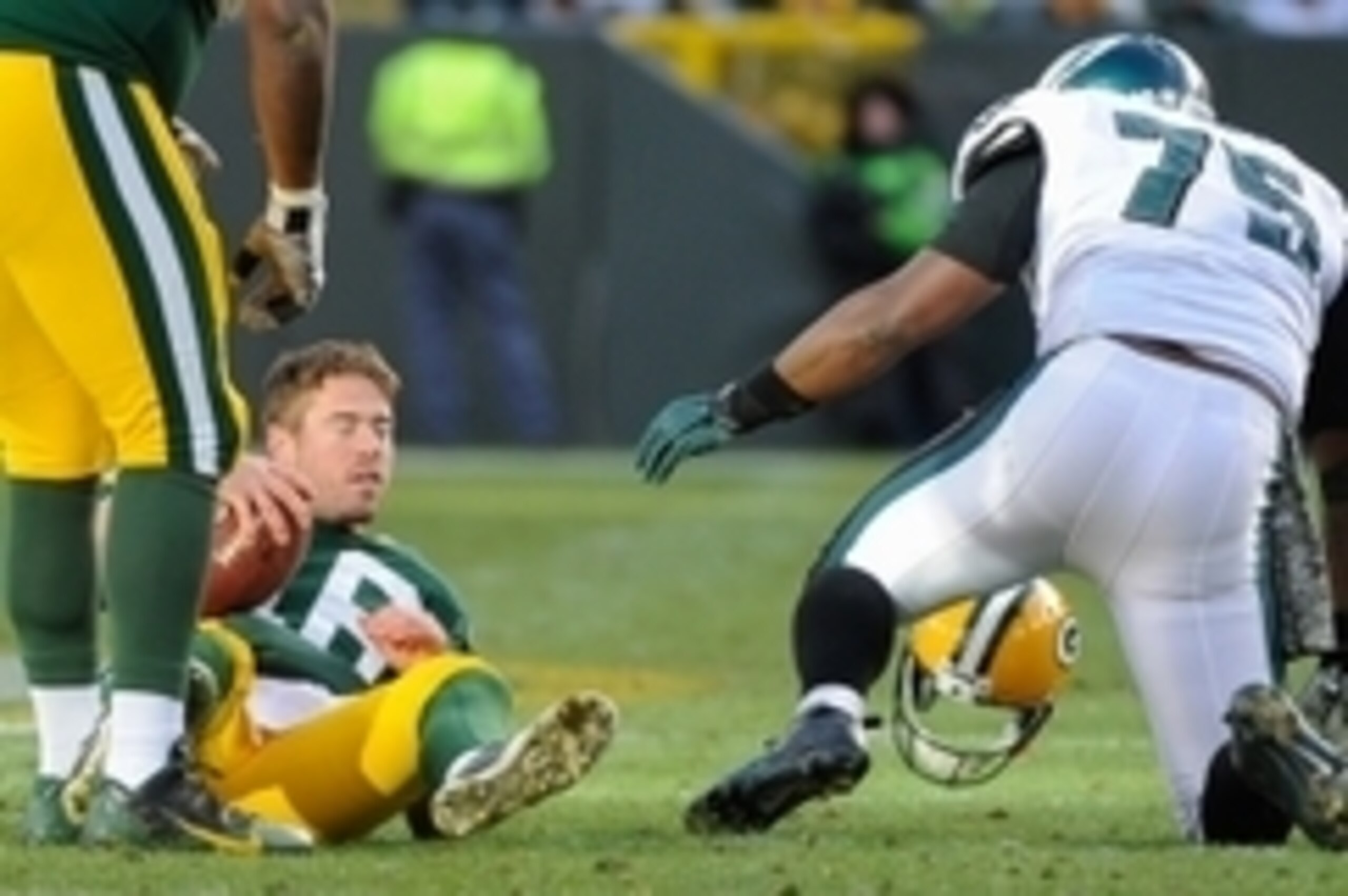 Nov 10, 2013; Green Bay, WI, USA; Green Bay Packers quarterback Scott Tolzien (16) is tackled by Philadelphia Eagles defensive end Vinny Curry (75) in the fourth quarter at Lambeau Field. The Eagles won 27-13. Mandatory Credit: Benny Sieu-USA TODAY Sports