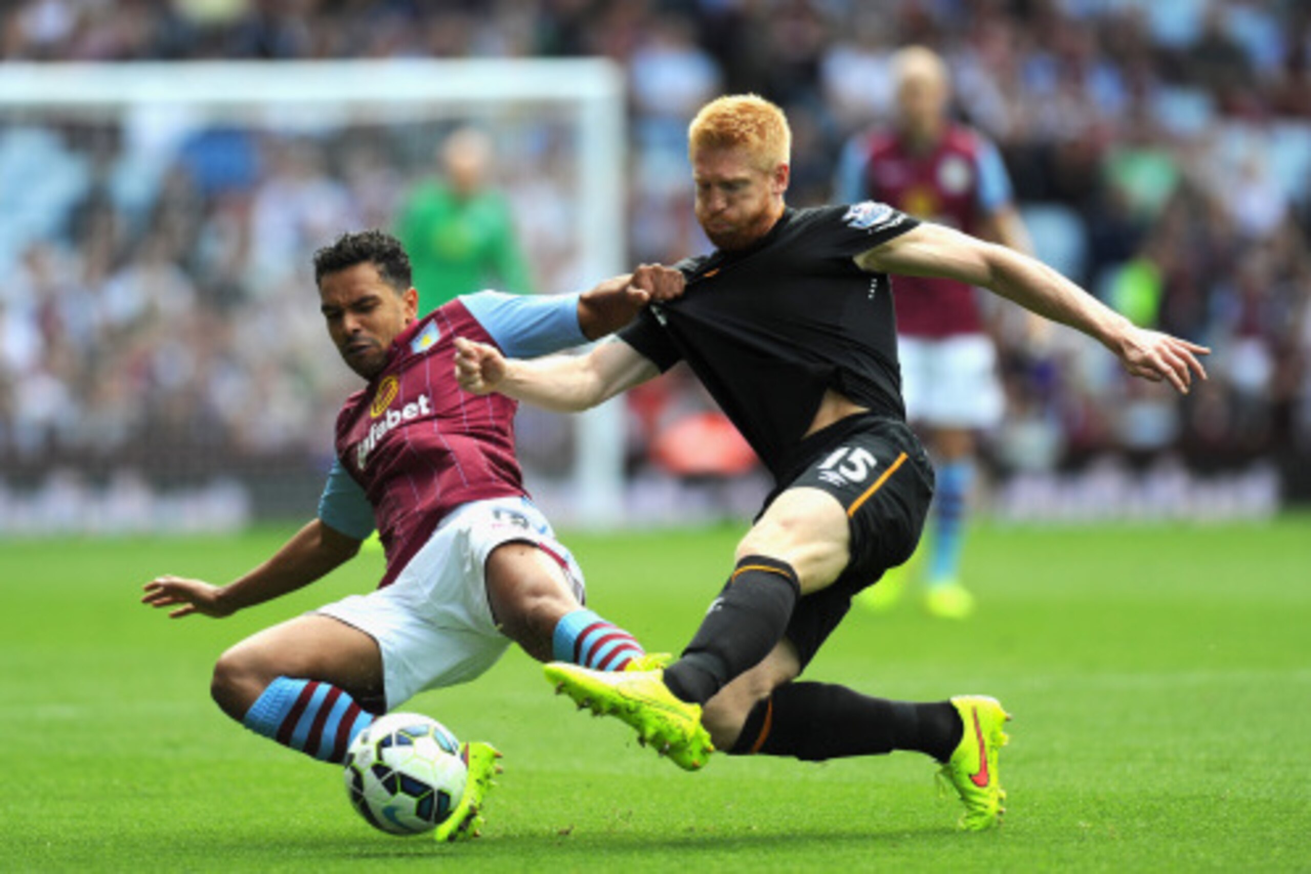 BIRMINGHAM, ENGLAND - AUGUST 31:  Hull City player Paul McShane (r) challenges Kieran Richardson of Villa during the Barclays Premier League match between Aston Villa and Hull City at Villa Park on August 31, 2014 in Birmingham, England.  (Photo by Stu Fo