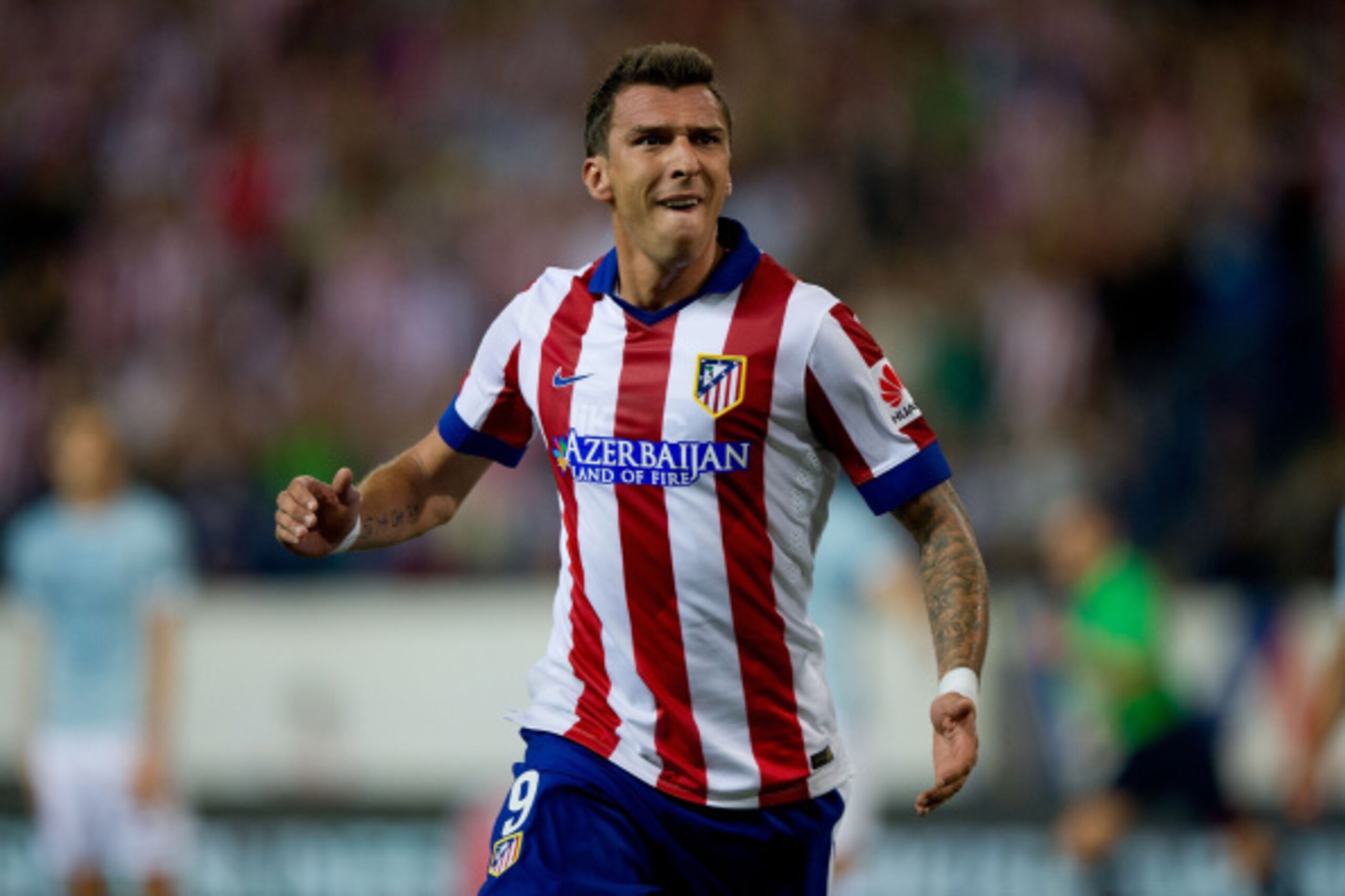 MADRID, SPAIN - AUGUST 30:  Mario Mandzukic of Atletico de Madrid celebrates scoring their second goal during the La Liga match between Club Atletico de Madrid and SD Eibar at Vicente Calderon Stadium on August 30, 2014 in Madrid, Spain.  (Photo by Gonzal