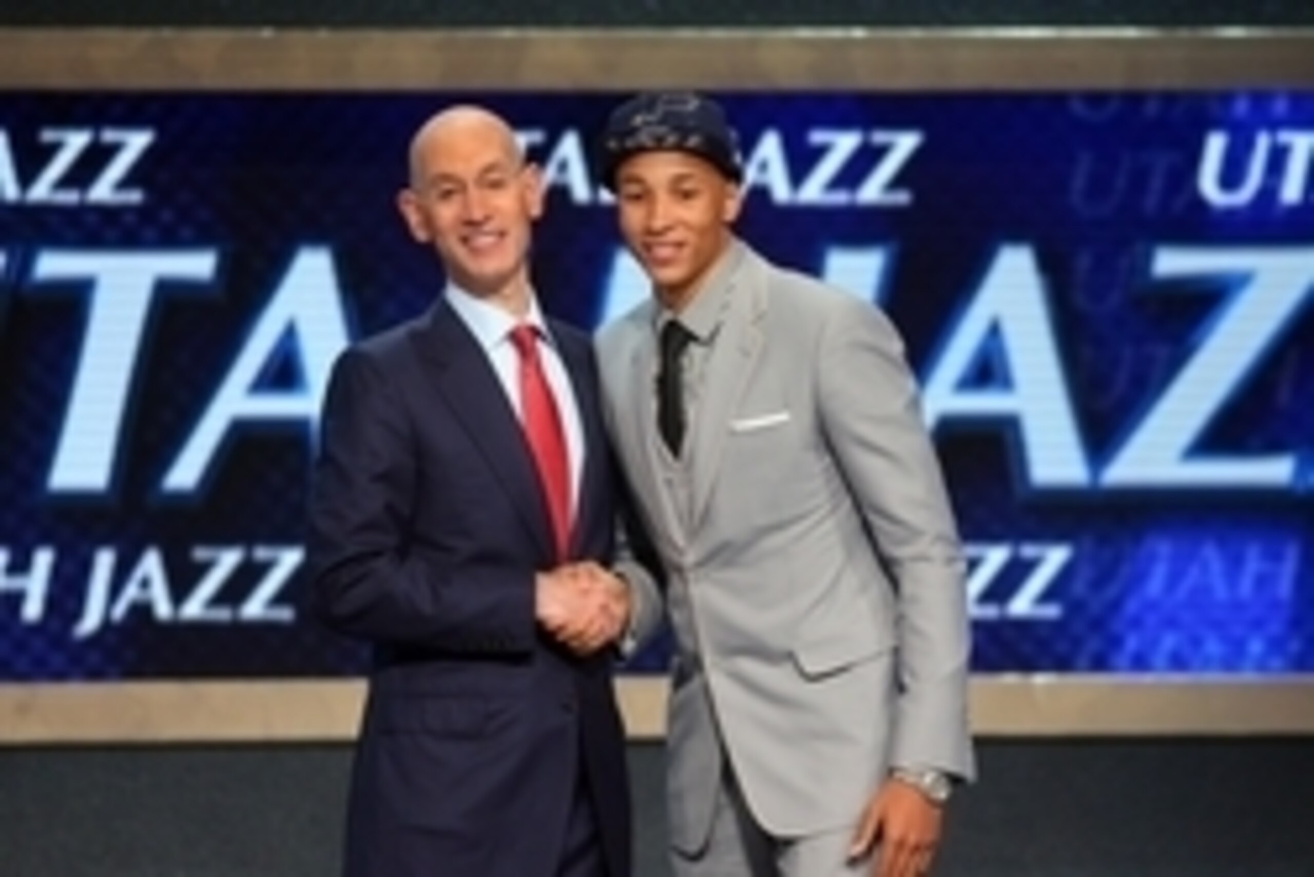 Jun 26, 2014; Brooklyn, NY, USA; Dante Exum (Australia) shakes hands with NBA commissioner Adam Silver after being selected as the number five overall pick to the Utah Jazz in the 2014 NBA Draft at the Barclays Center. Mandatory Credit: Brad Penner-USA TO Jun 26, 2014; Brooklyn, NY, USA; Dante Exum (Australia) shakes hands with NBA commissioner Adam Silver after being selected as the number five overall pick to the Utah Jazz in the 2014 NBA Draft at the Barclays Center. Mandatory Credit: Brad Penner-USA TO